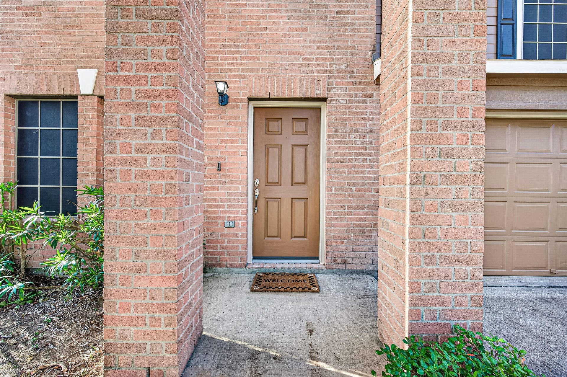 19707 Dayton Springs Drive, Cypress, TX 77429 Charming brick entryway with a welcoming front door.