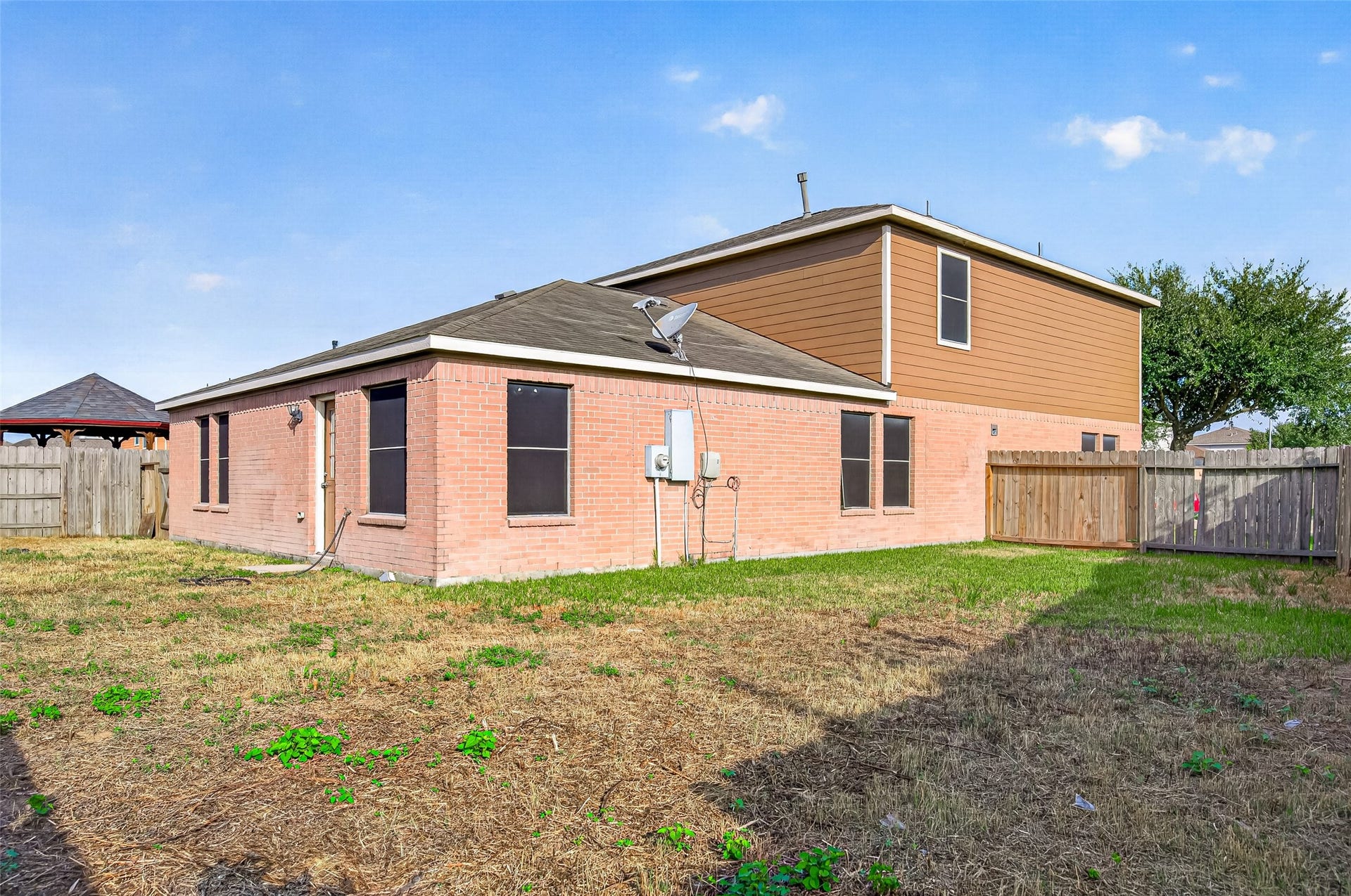 19707 Dayton Springs Drive, Cypress, TX 77429 Spacious backyard with privacy fence, perfect for outdoor activities.