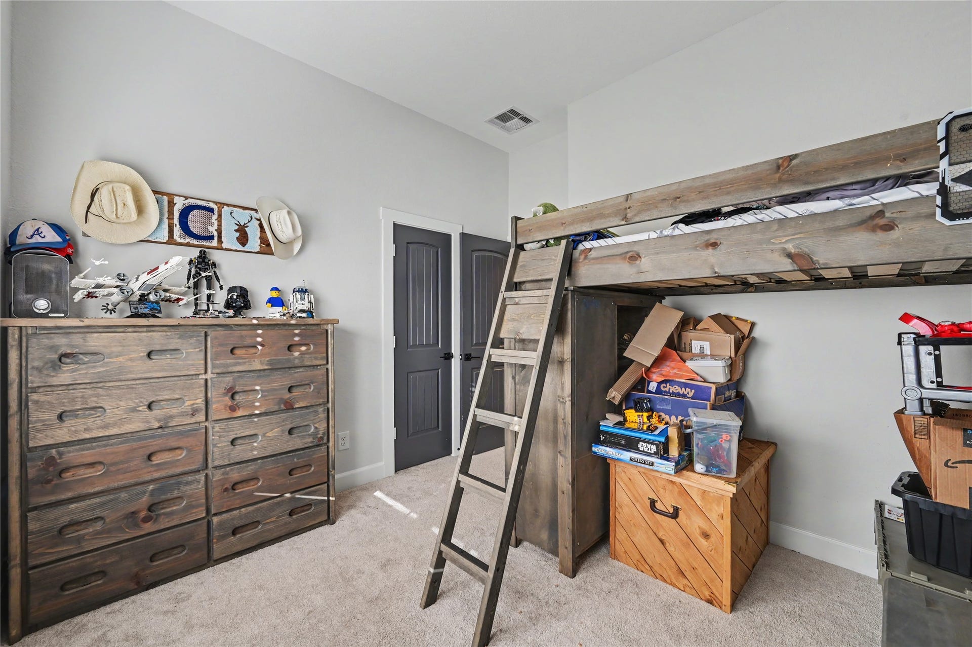 This secondary bedroom offers a functional layout with plenty of room for furnishings and personal storage. The closet provides convenient organization options, while the bright interior creates a comfortable and welcoming atmosphere.