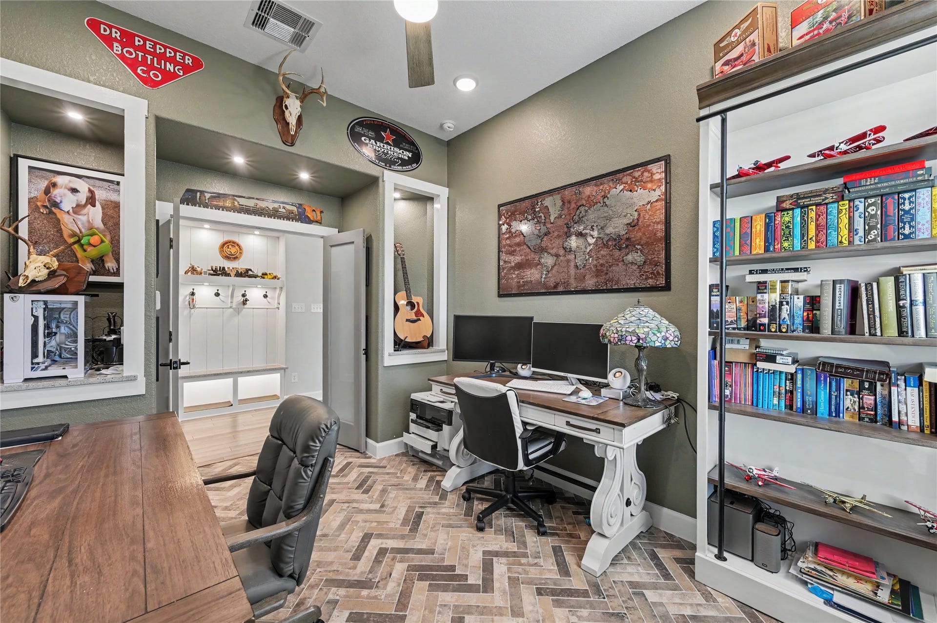 This beautifully designed home office offers a dedicated space for working, studying, or pursuing creative projects. Featuring built-in shelving, generous workspace, and stylish finishes, the room combines functionality with a sophisticated look.