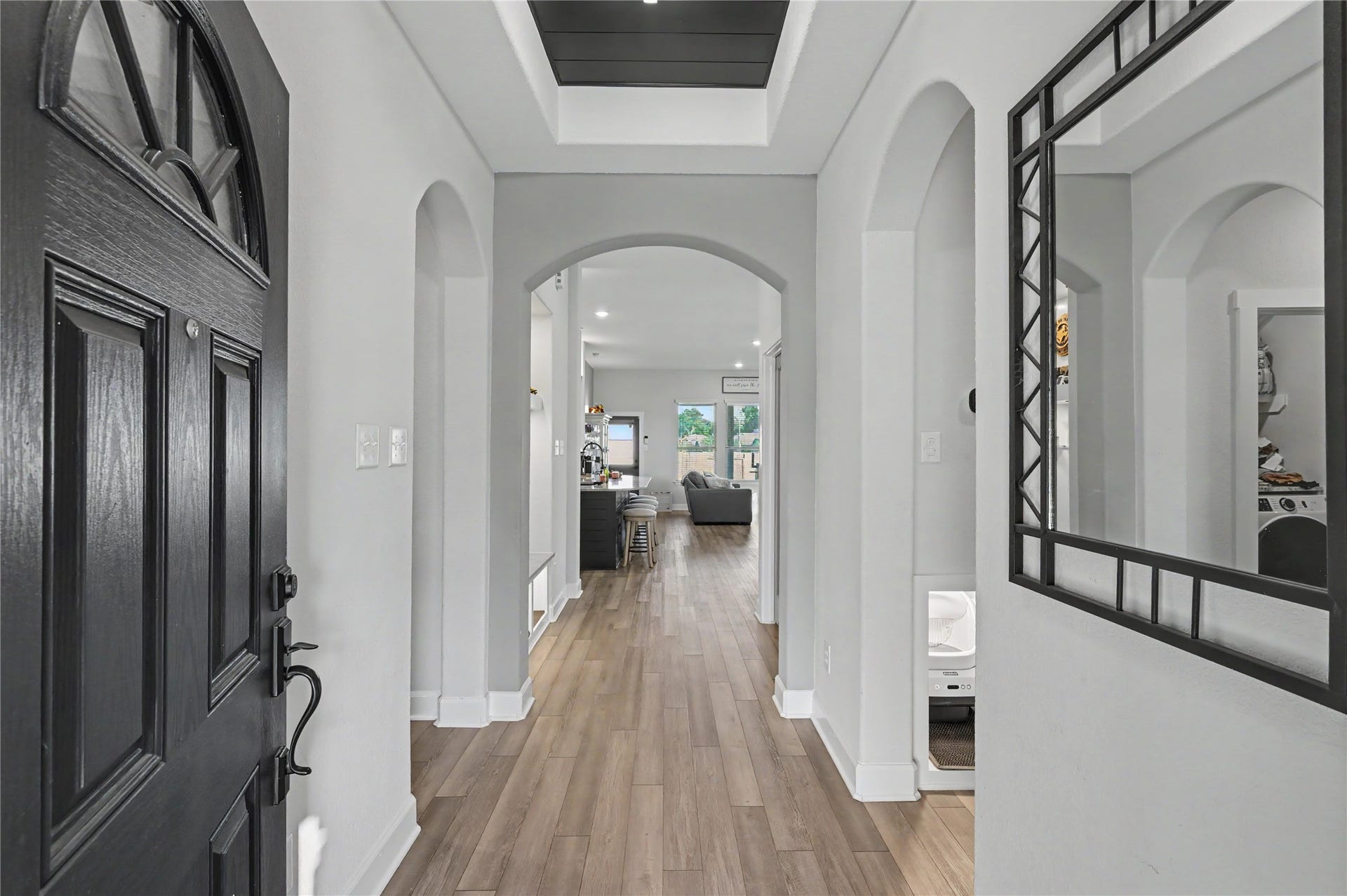 Step inside to a beautiful entryway featuring soaring ceilings, elegant flooring, and an abundance of natural light. The spacious foyer creates a bright and welcoming atmosphere while offering a lovely introduction to the home's thoughtfully designed interior.