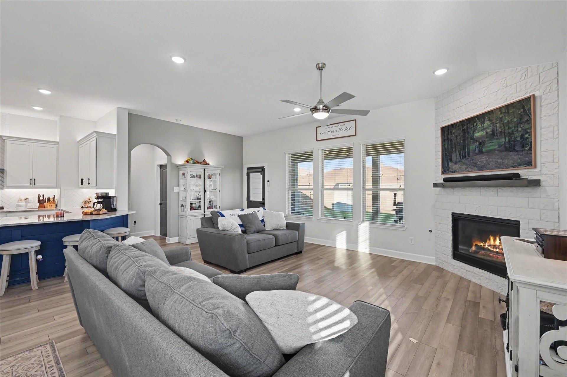 The welcoming family room features a spacious layout, beautiful flooring, and a seamless connection to the kitchen and dining areas. With plenty of natural light and room for comfortable seating, this space is perfect for gathering and entertaining.