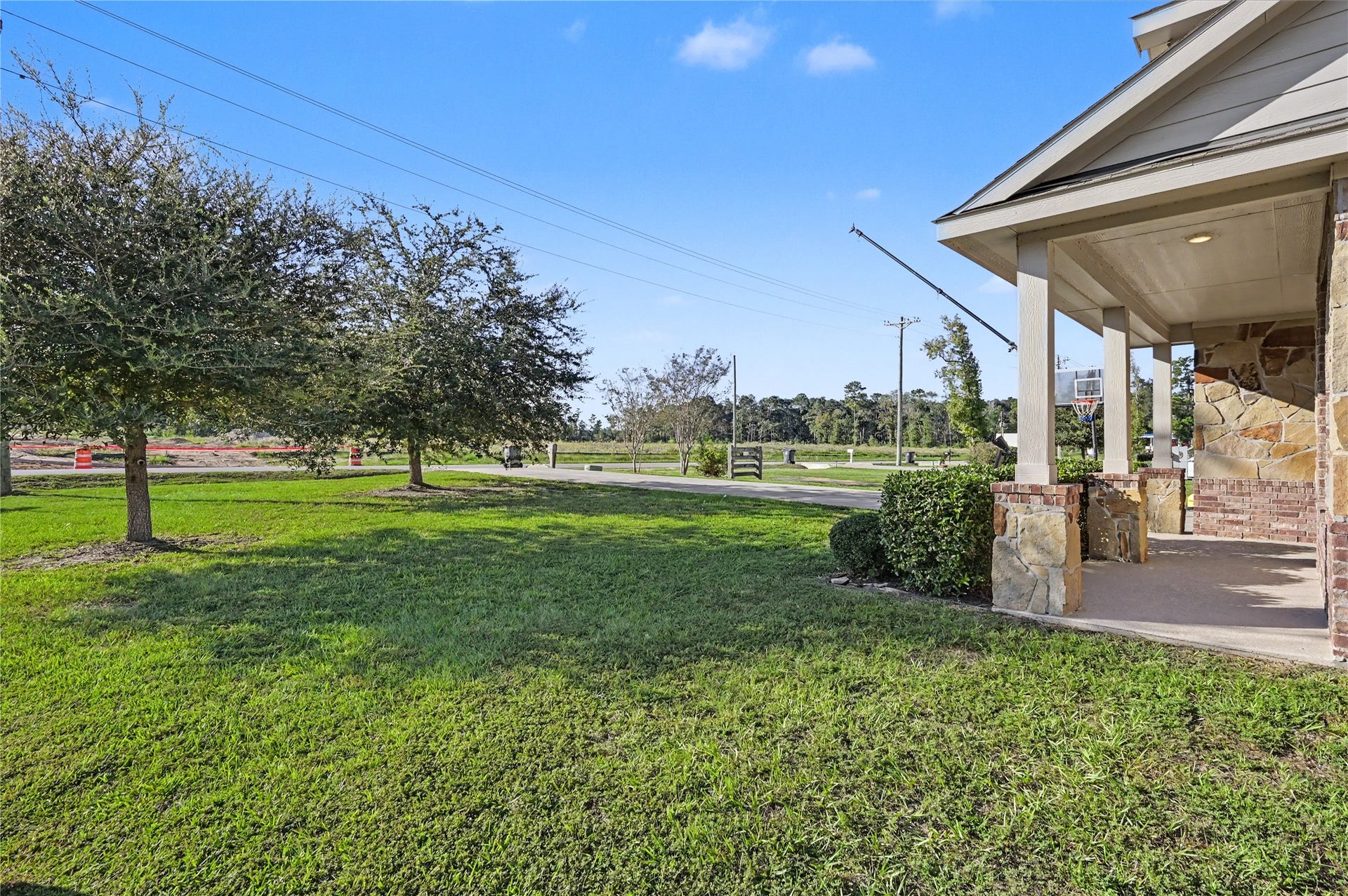 Enjoy the peaceful setting of this spacious backyard, complete with mature trees and plenty of green space. The open lawn provides ample room for outdoor entertaining, recreation, or simply relaxing and enjoying the fresh air.