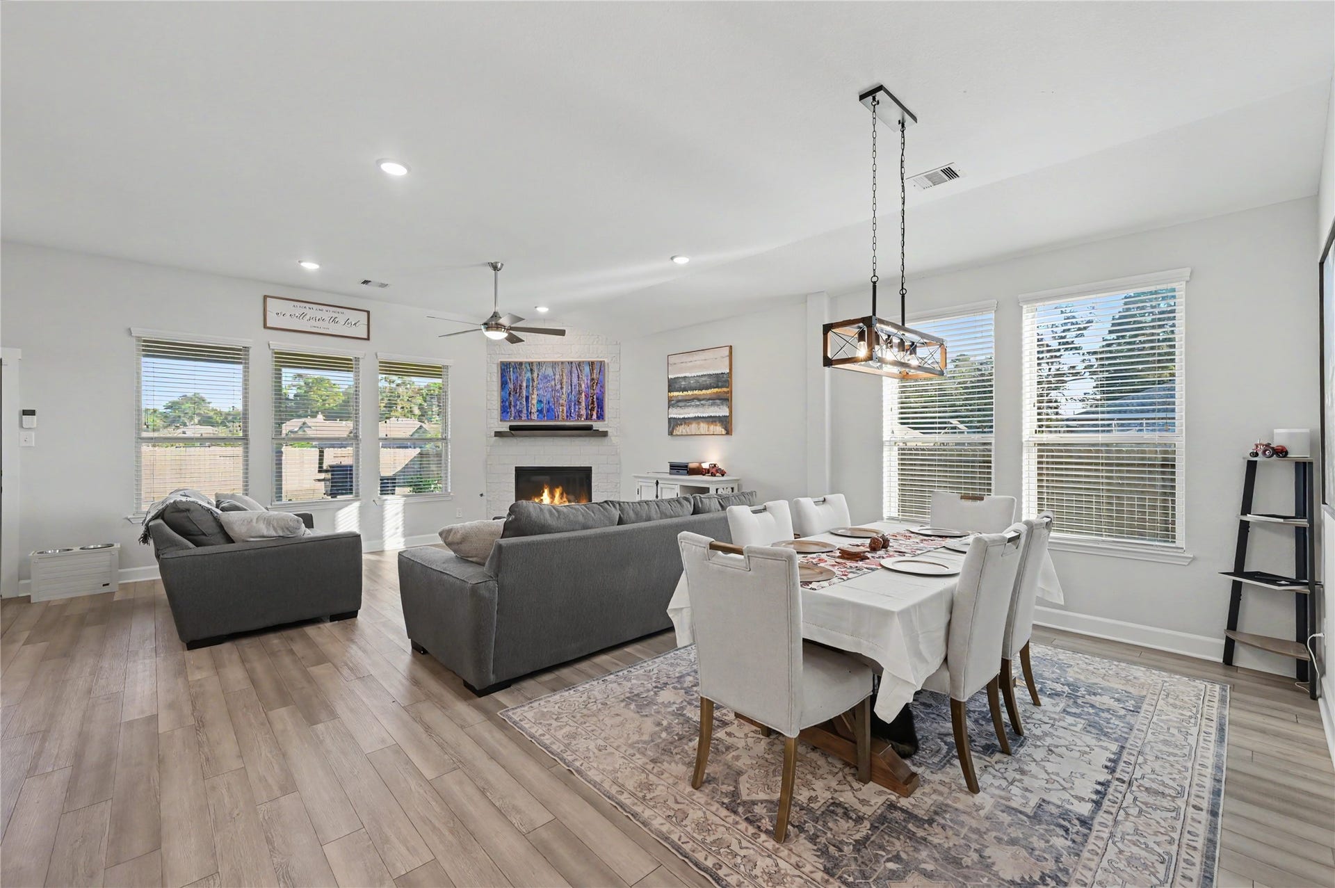 Enjoy the spacious open-concept design that effortlessly connects the living and dining areas. Large windows, stylish lighting, and thoughtfully arranged spaces provide an ideal setting for hosting guests or relaxing at home.