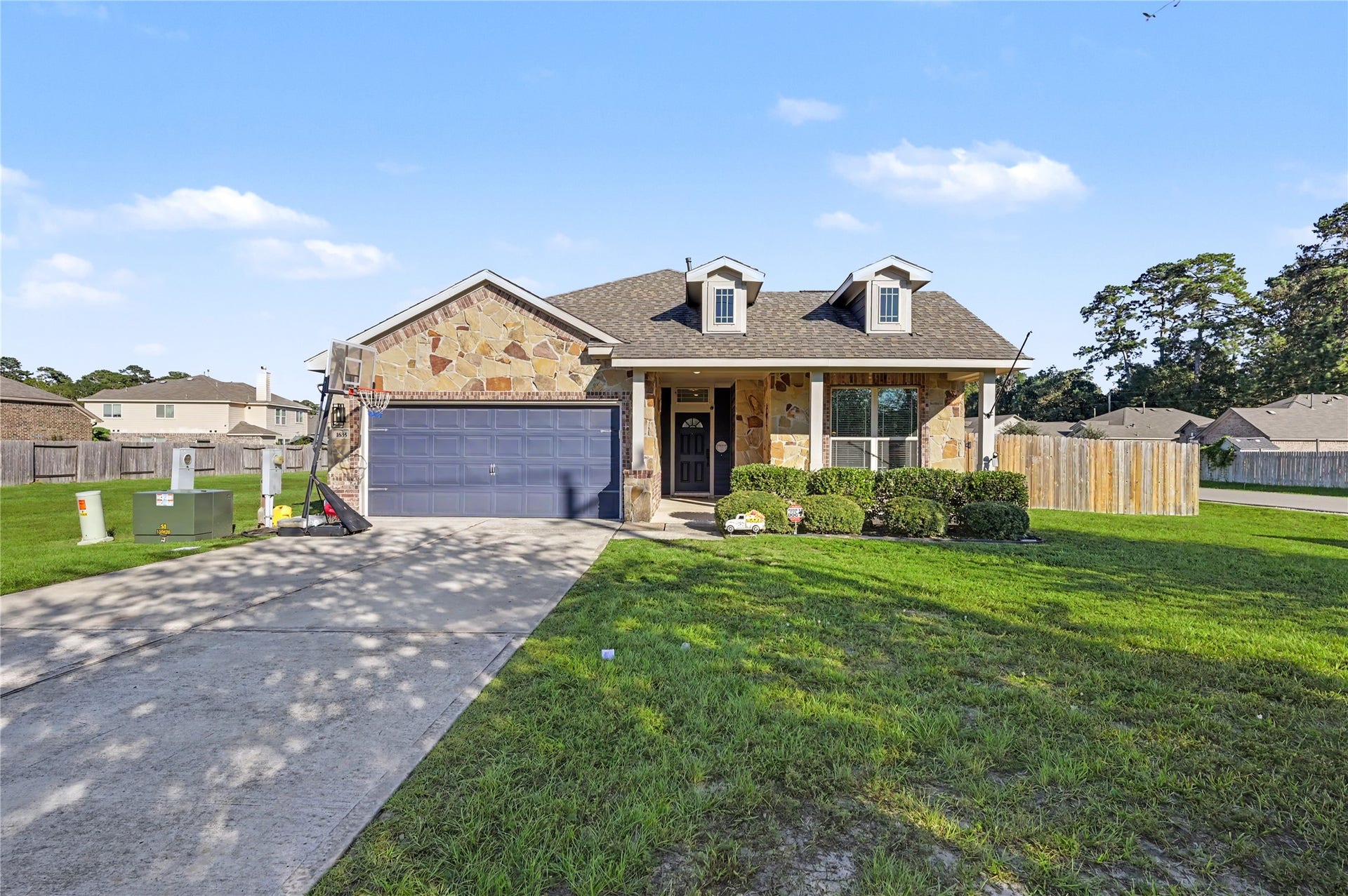 Beautiful curb appeal welcomes you to this charming home, featuring an attractive exterior, spacious driveway, and well-maintained lawn. The inviting front elevation creates a wonderful first impression.