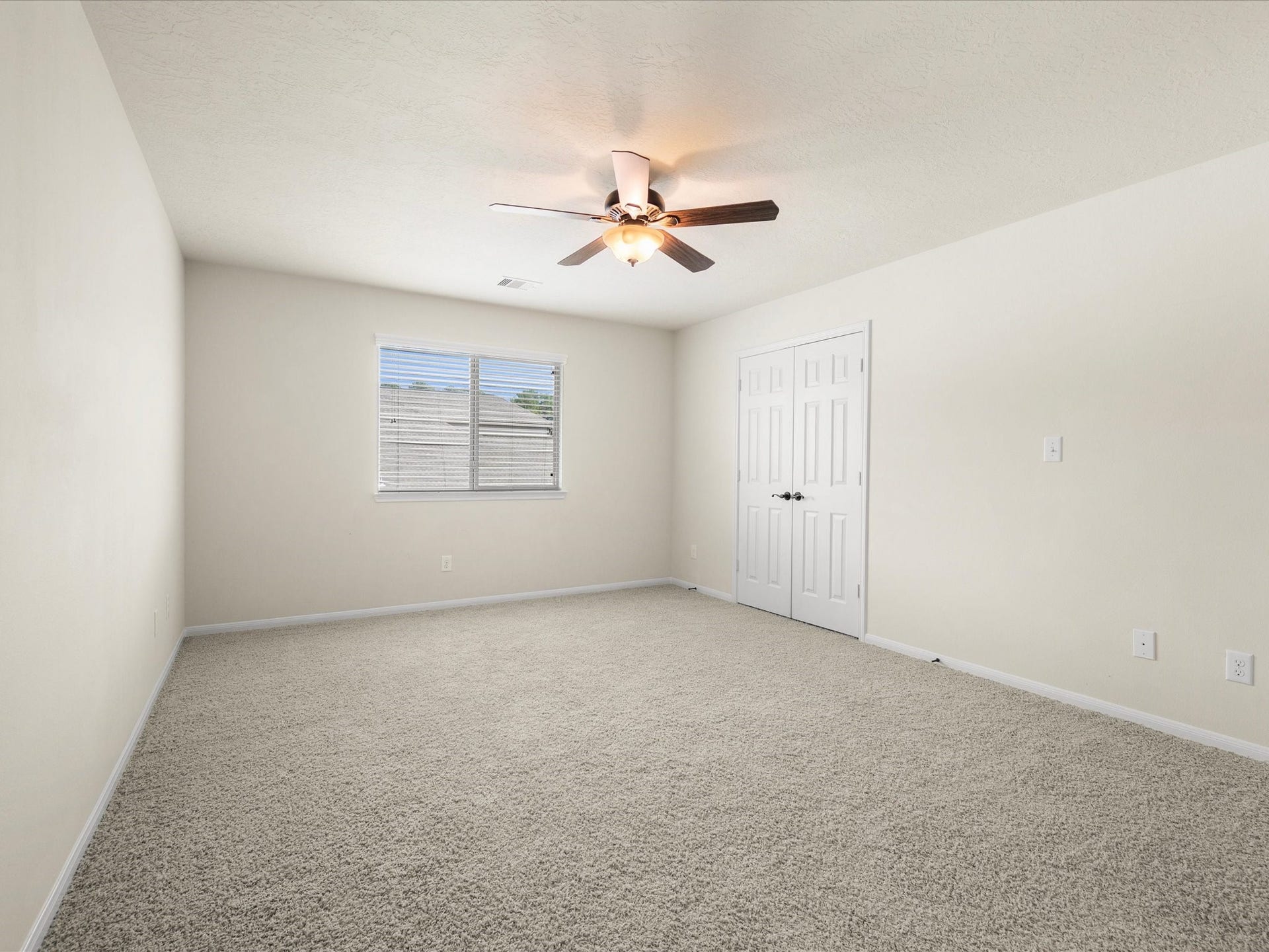10458 Waterstone Estates Court, Tomball, TX 77375 One of five spacious bedrooms, this well-maintained room offers comfortable space for family, guests, or a dedicated retreat to suit your needs.