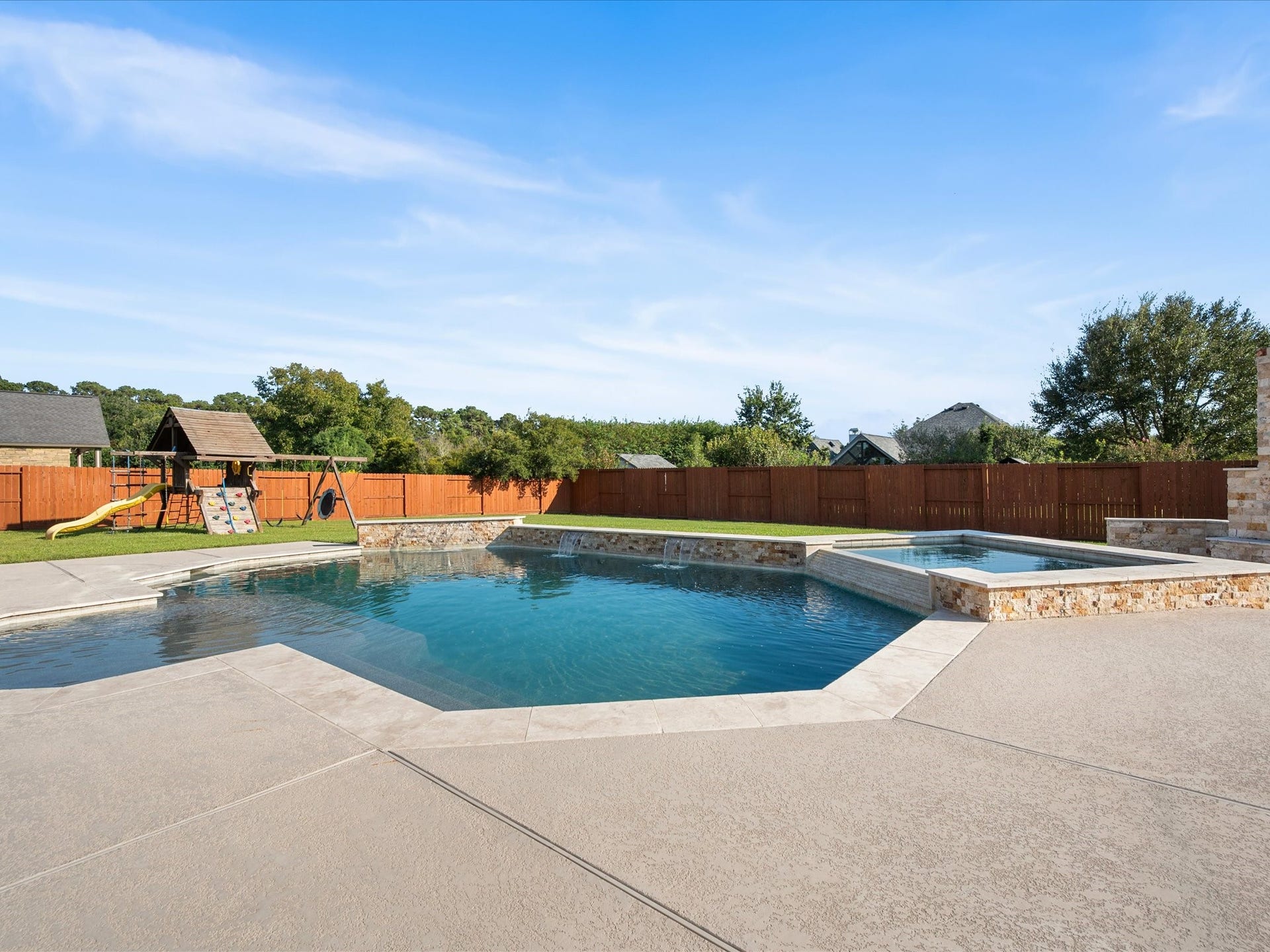 10458 Waterstone Estates Court, Tomball, TX 77375 Imagine afternoons by the pool, evenings unwinding in the spa, and weekends spent entertaining beneath the covered patio, all with an expansive backyard as your own outdoor retreat.