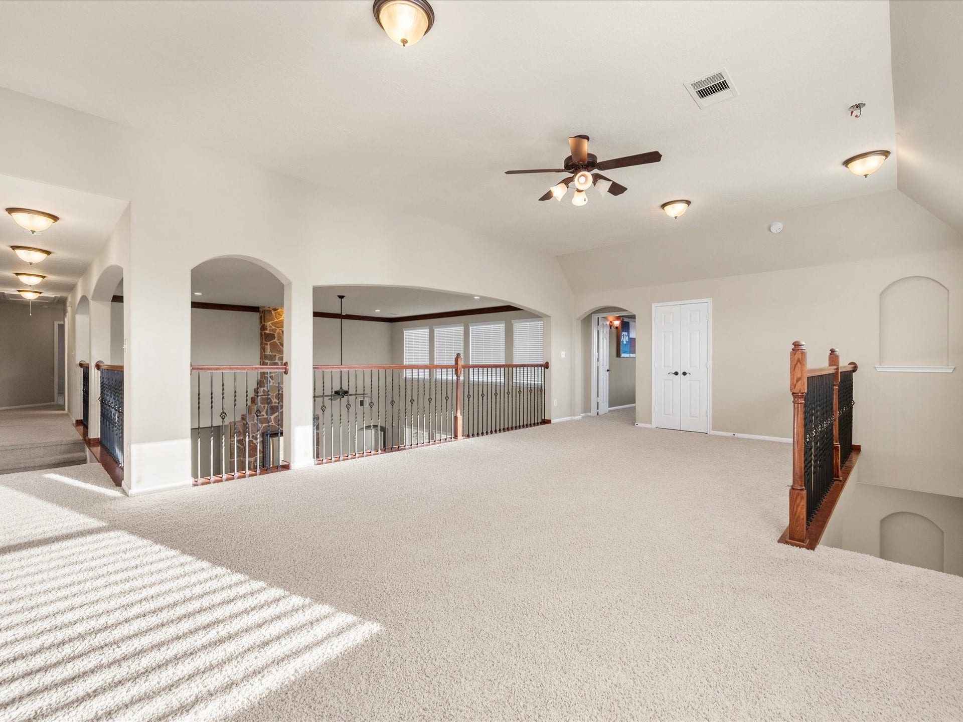 10458 Waterstone Estates Court, Tomball, TX 77375 The expansive upstairs game room offers plenty of space for friendly competition, family game nights, hobbies, and the everyday moments that become lasting memories.