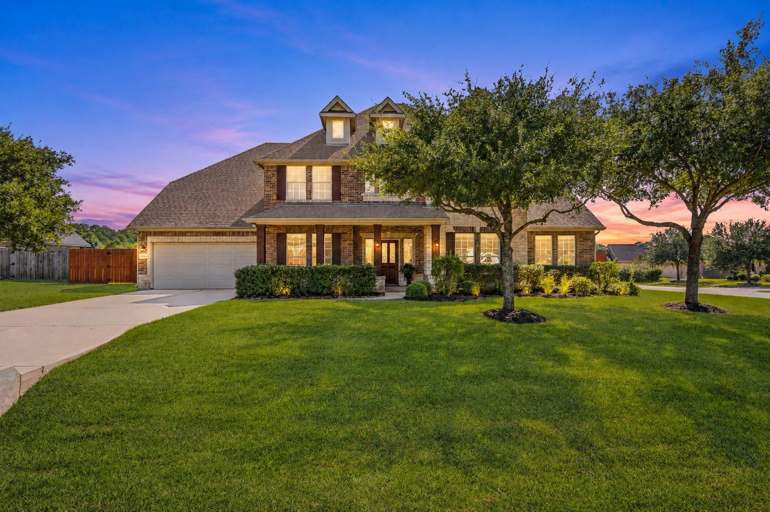 10458 Waterstone Estates Court, Tomball, TX 77375 Classic brick architecture, a welcoming front porch, and a spacious 3-car garage create an attractive introduction to this stately residence.