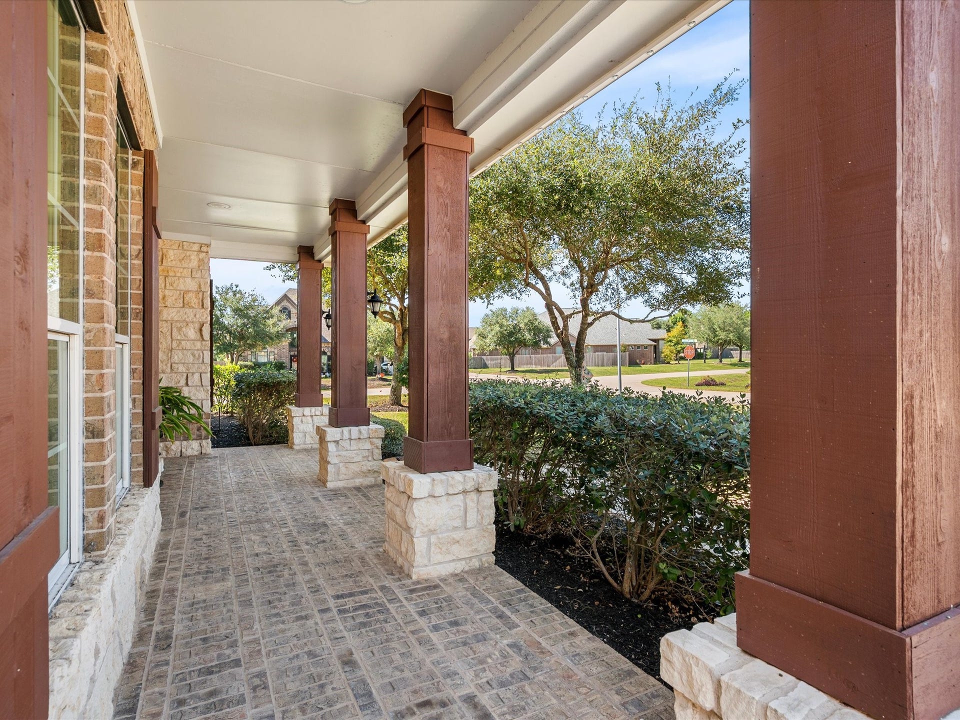 10458 Waterstone Estates Court, Tomball, TX 77375 Beautiful brickwork carries through to the front porch, adding warmth and character to this inviting entrance.