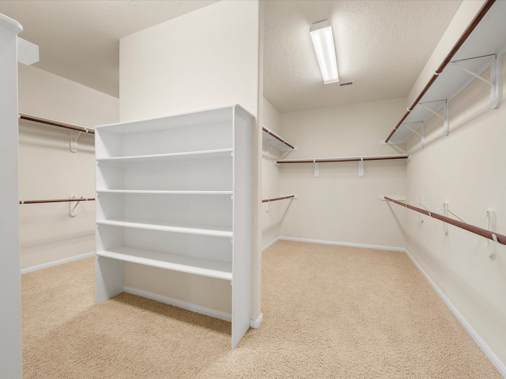 10458 Waterstone Estates Court, Tomball, TX 77375 An oversized walk-in closet offers generous room for clothing, shoes, and accessories, bringing welcome storage to this spacious primary suite.