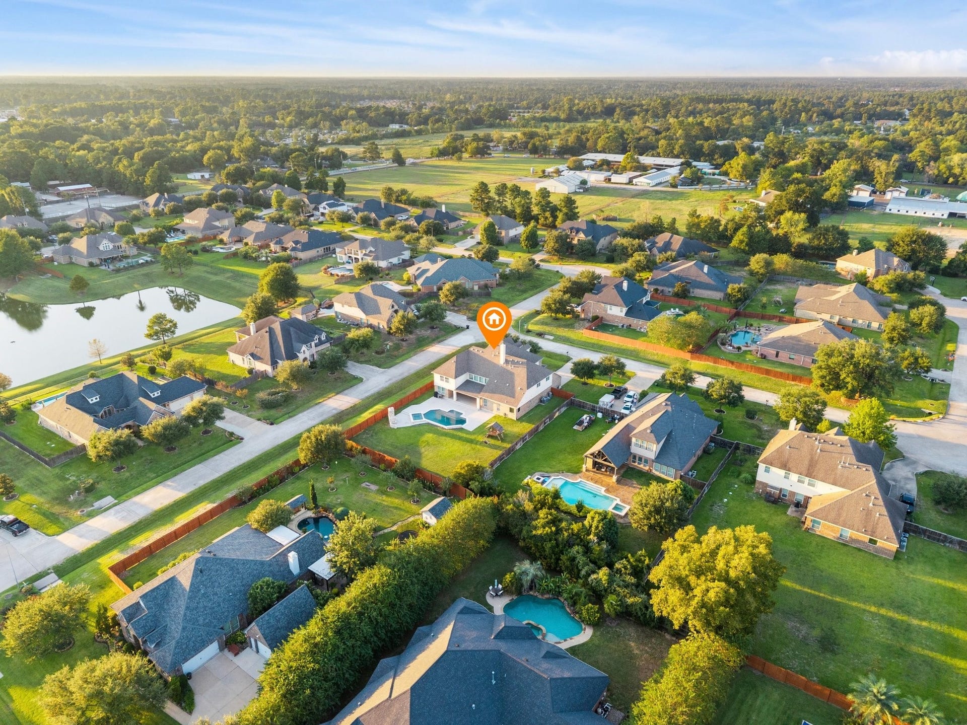 10458 Waterstone Estates Court, Tomball, TX 77375 Set on over half an acre, this property enjoys room to spread out within a serene community featuring walking and jogging paths and a beautiful pond, all just moments from Burroughs Park and The Woodlands.