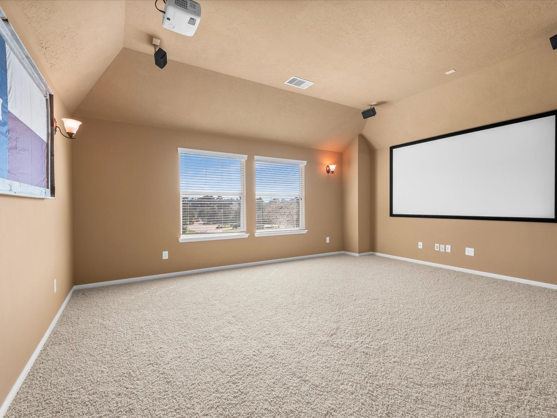 10458 Waterstone Estates Court, Tomball, TX 77375 With generous space to arrange your ideal entertainment setup, this media room is ready to become the favorite destination for movie nights, game-day gatherings, and evenings spent together.