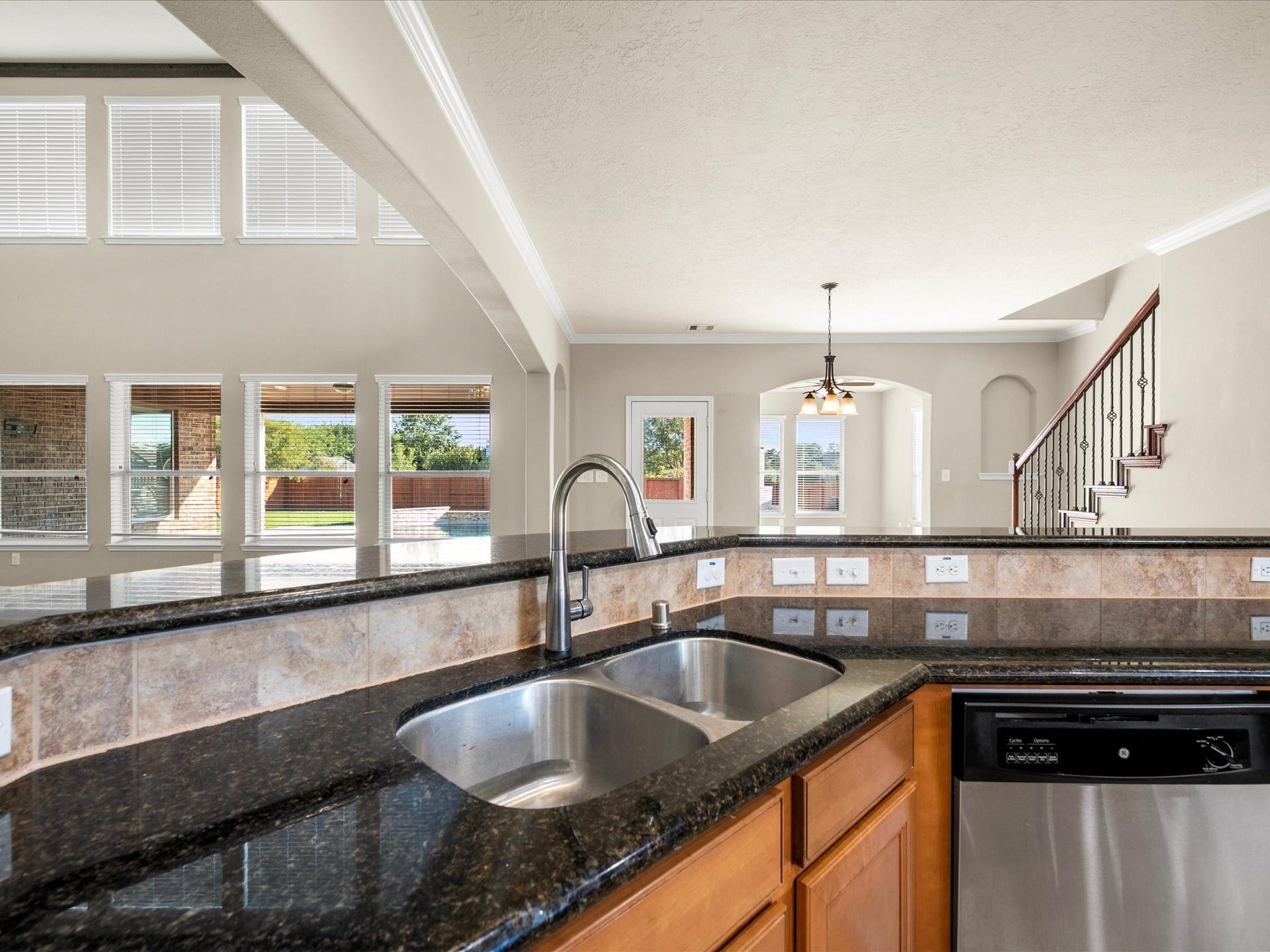 10458 Waterstone Estates Court, Tomball, TX 77375 Enjoy the ease of an open layout where the kitchen, breakfast nook, and living room connect, keeping you close to the conversation whether preparing a meal or relaxing with family.