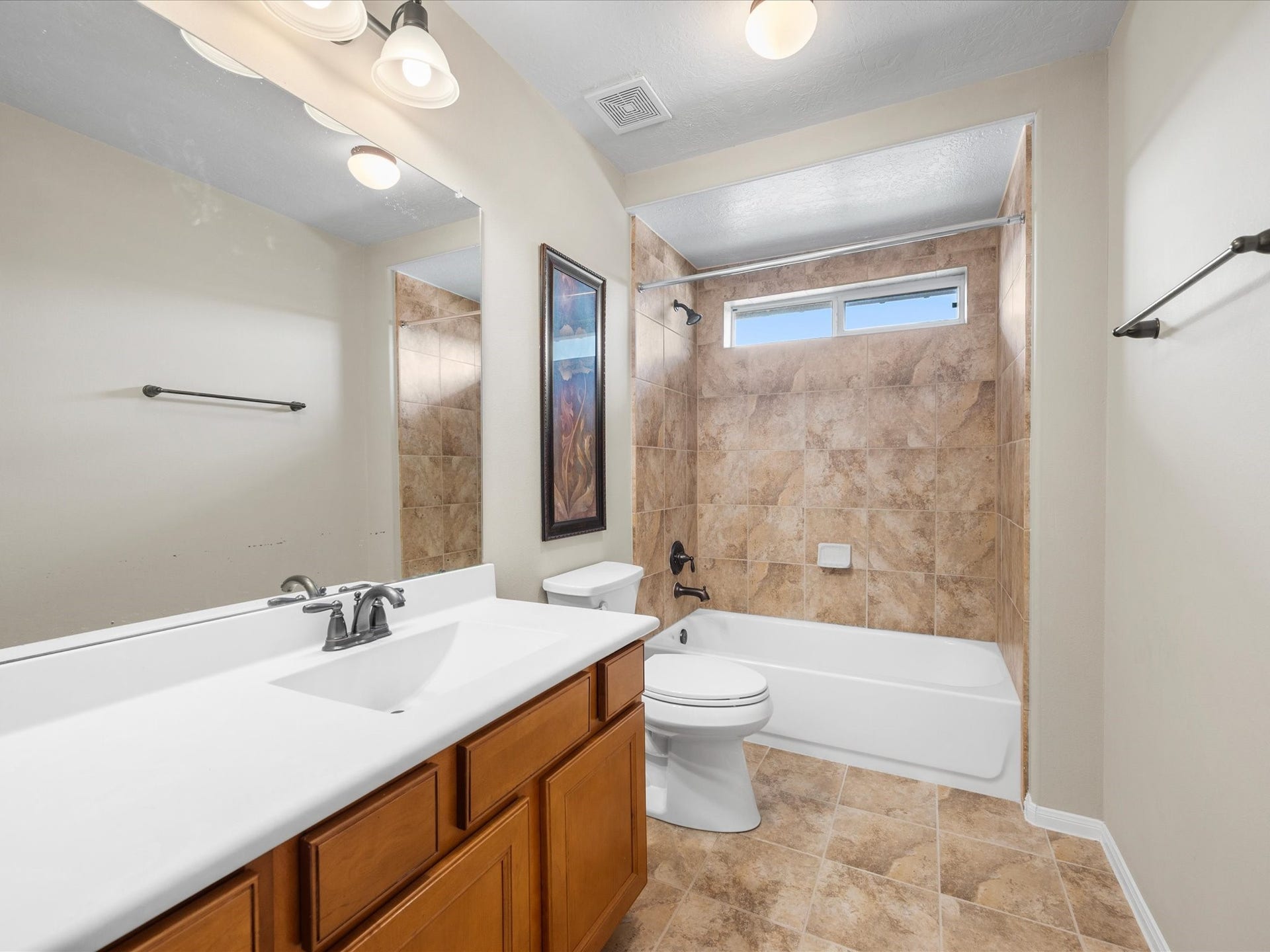 10458 Waterstone Estates Court, Tomball, TX 77375 Another full bathroom upstairs adds convenience for family and guests, supporting the home's generous bedroom count and flexible layout.