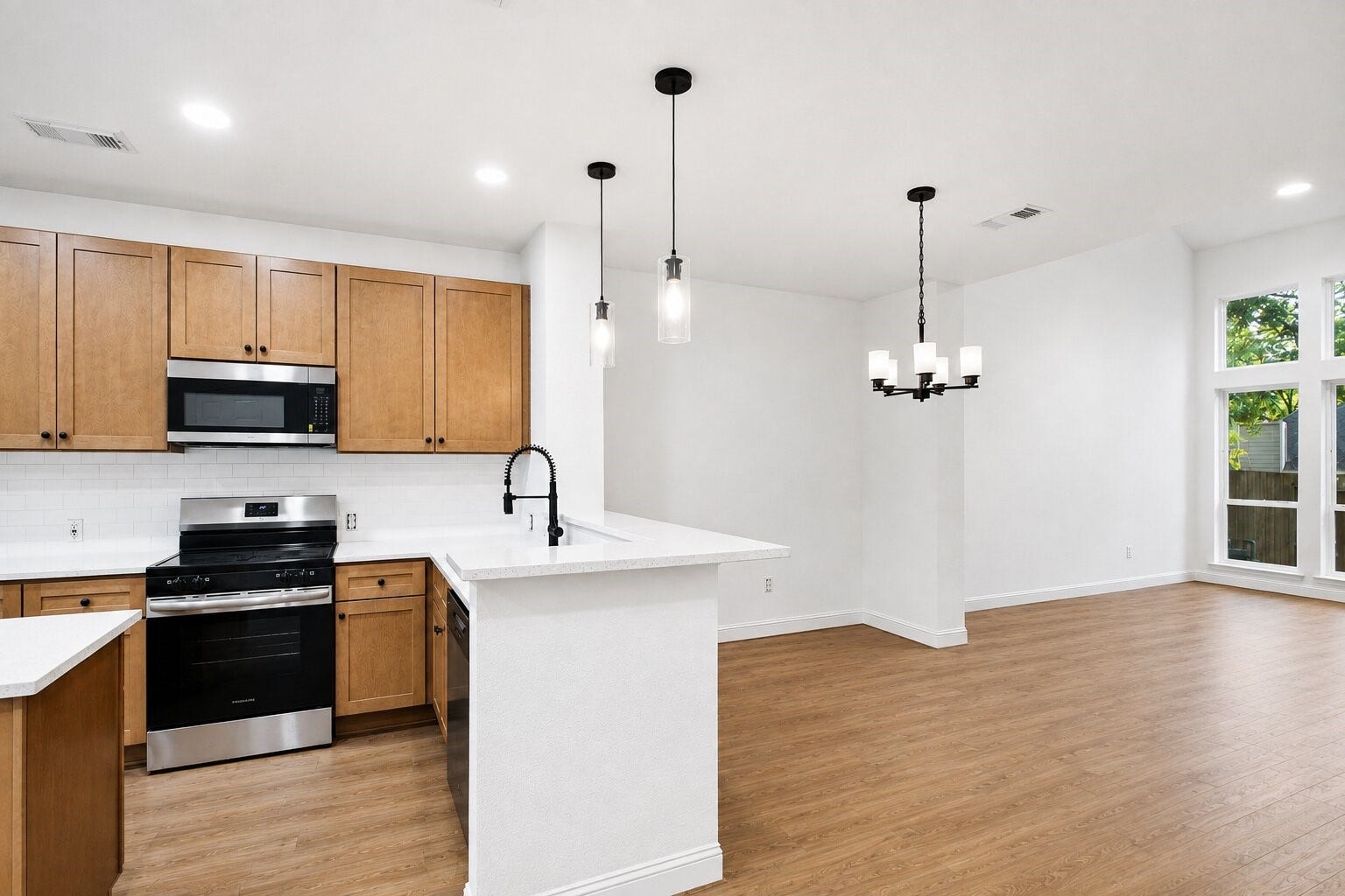 47 Alderon Woods Place, Spring, TX 77382 The kitchen features abundant cabinetry, generous counter space and a breakfast bar for casual seating.