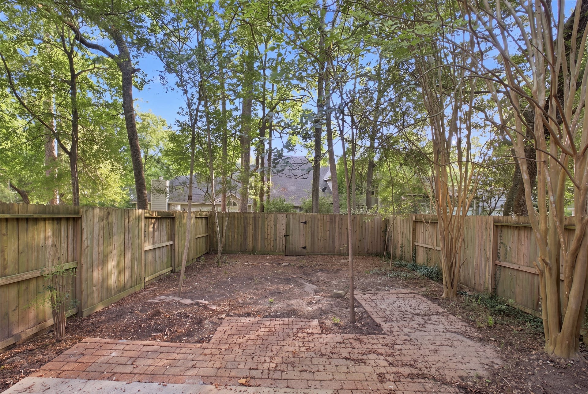 47 Alderon Woods Place, Spring, TX 77382 The paver patio provides a ready spot for outdoor seating.