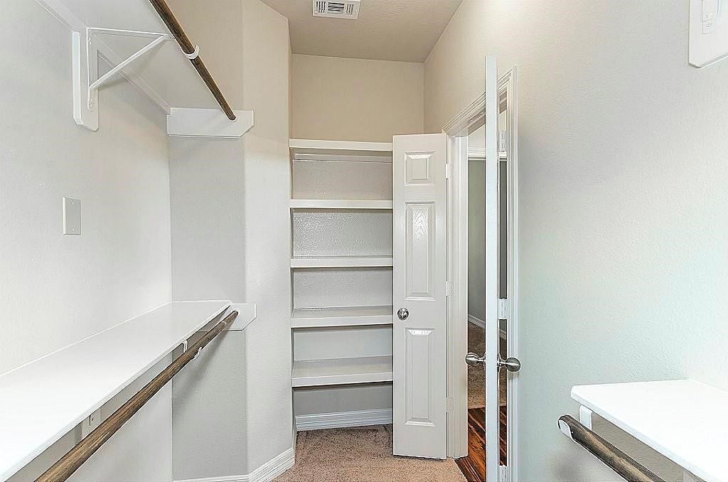 317 Woodland HIlls Drive, #B, Conroe, TX 77303 This picture is not updated to show the new vinyl plank flooring, but closet is same.