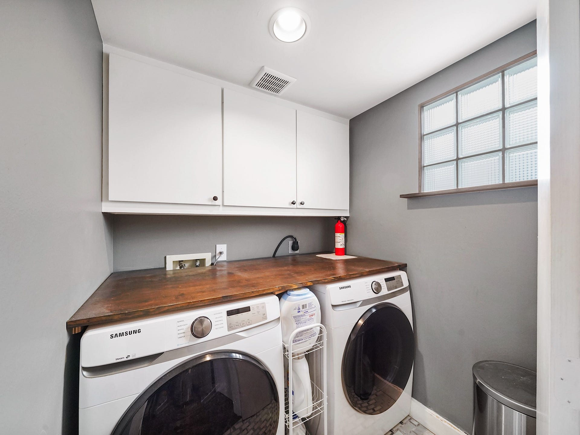 1231 Jackson Boulevard, Houston, TX 77006 This spacious and efficient laundry room offers ample storage and a perfect setup for all your chores.