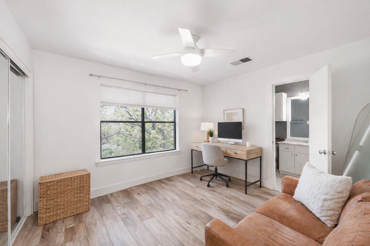 1231 Jackson Boulevard, Houston, TX 77006 This inviting secondary bedroom offers a cozy and versatile space, perfect for guests or family, with ample natural light and a functional layout.