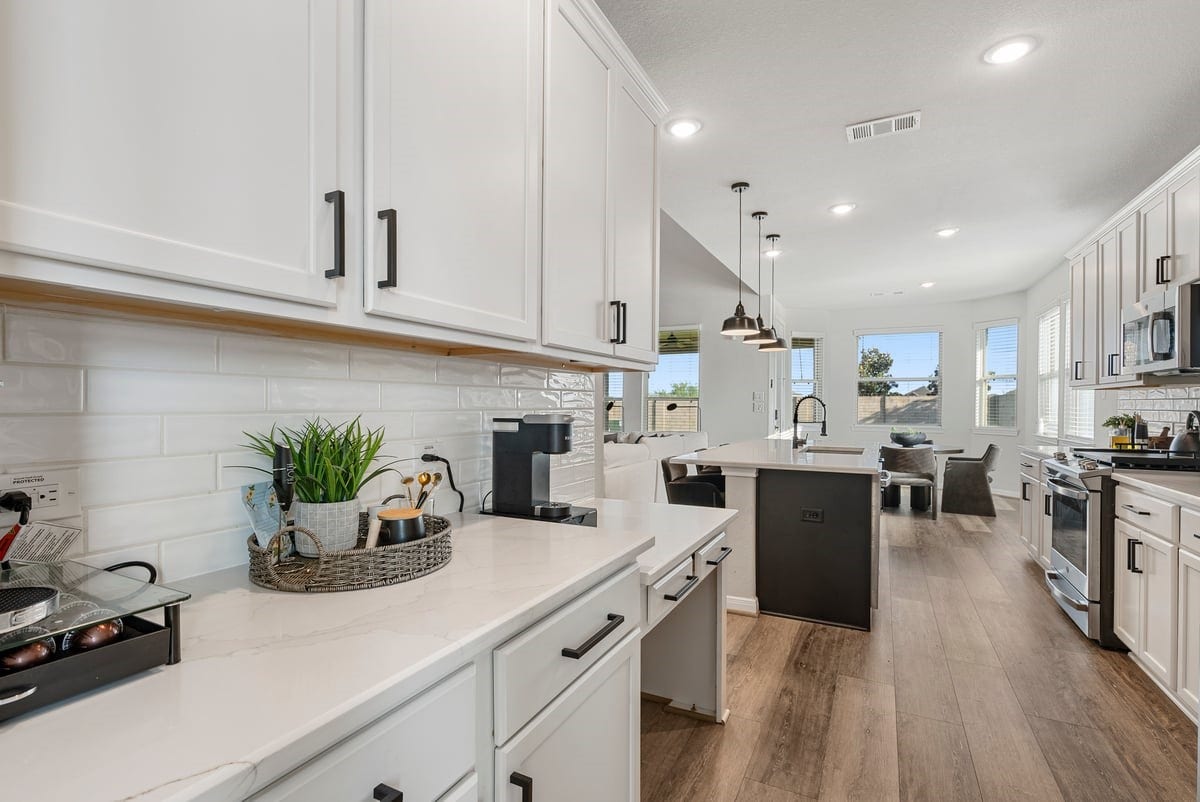 1702 Darwin Cedar Drive, Rosharon, TX 77583 The kitchen has a masterful design with an additional pantry area and built in desk!