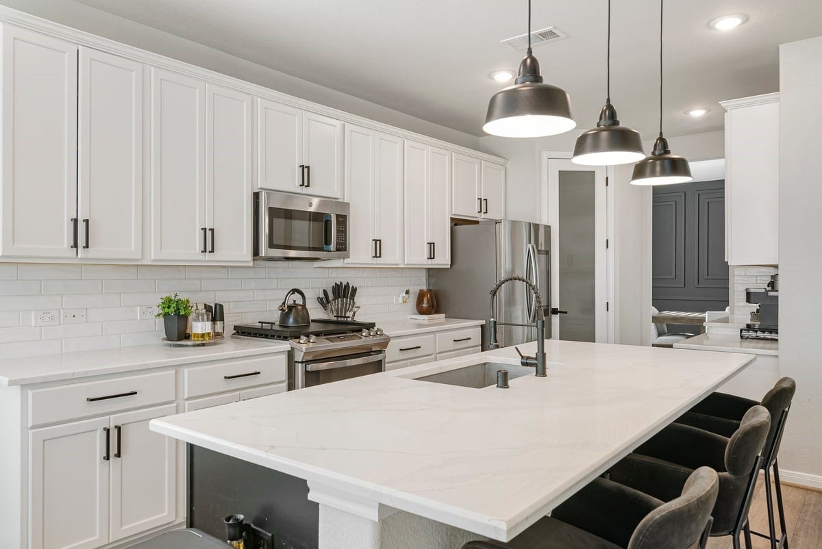 1702 Darwin Cedar Drive, Rosharon, TX 77583 Imagine gathering with friends around this expansive kitchen island! Enjoy plenty of storage space with an abundance of cabinetry!