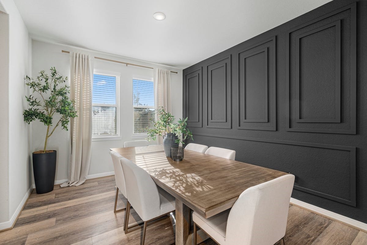1702 Darwin Cedar Drive, Rosharon, TX 77583 Dine in style! This dining room creates the perfect setting for meals with natural light and stunning accent wall!