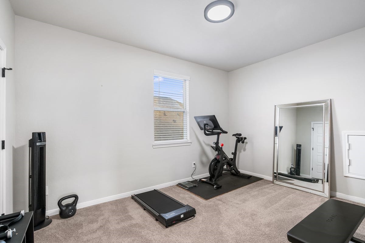 1702 Darwin Cedar Drive, Rosharon, TX 77583 This bedroom is currently being used as a gym, demonstrating the versatility of this home!