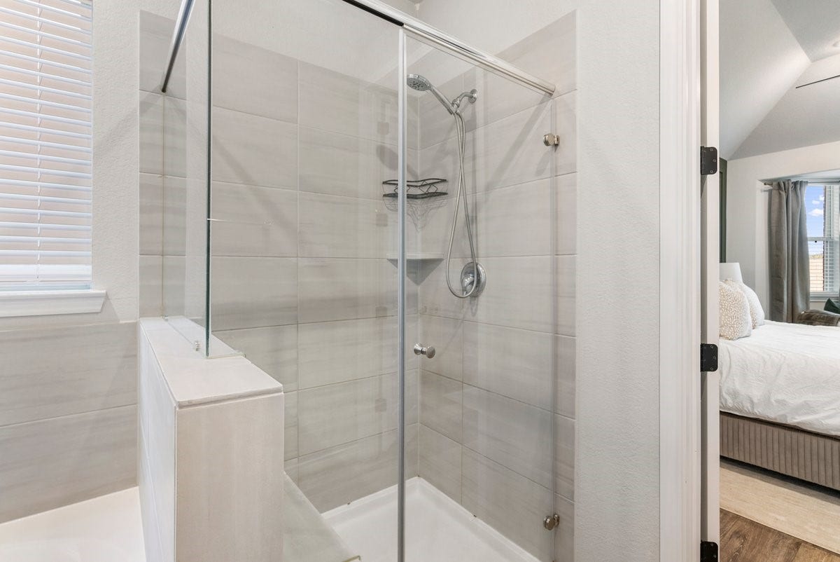 1702 Darwin Cedar Drive, Rosharon, TX 77583 The glass enclosure highlights the stunning tiled shower!