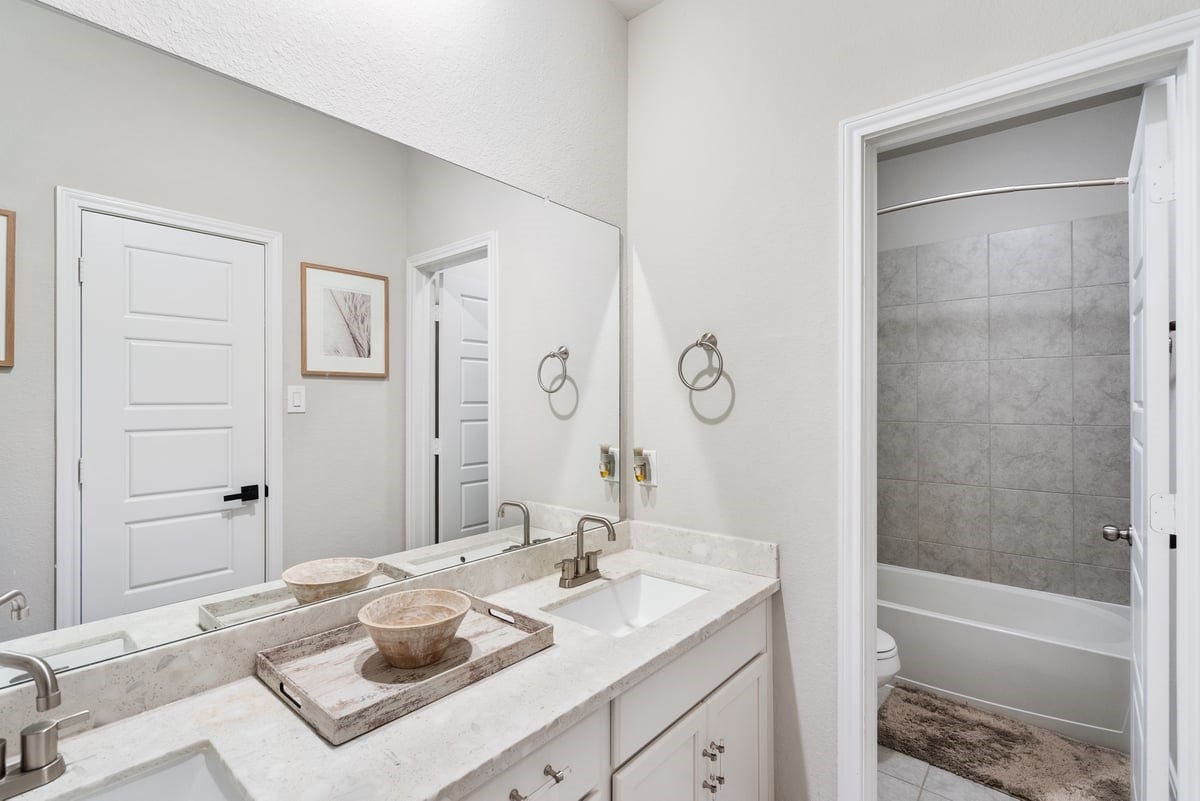 1702 Darwin Cedar Drive, Rosharon, TX 77583 A full bath upstairs echoes the elegance of the other bathrooms! Enjoy plenty of storage space and a private showering area!