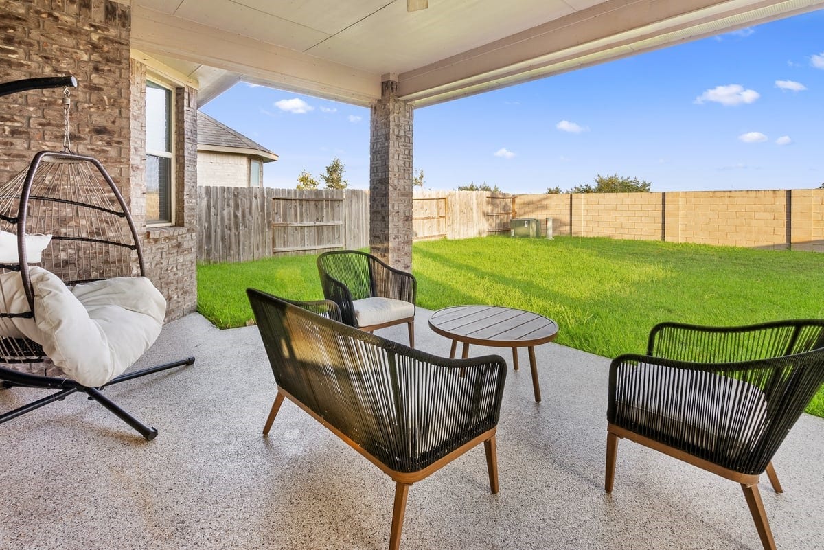1702 Darwin Cedar Drive, Rosharon, TX 77583 The extended patio has a cover, and is upgraded with epoxy flooring providing a great relaxing space.