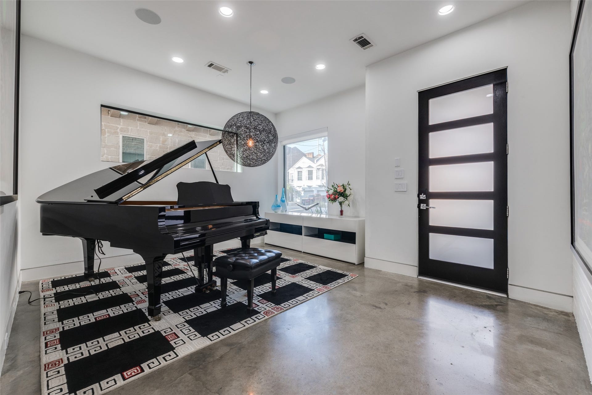 2014 Park Street, Houston, TX 77019 Enjoy Entertaining in this front facing Dining Room or Piano Room, polished concrete floors, gorgeous black modern designer chandelier, LED lights, privacy glass front door, in ceiling speakers, large windows