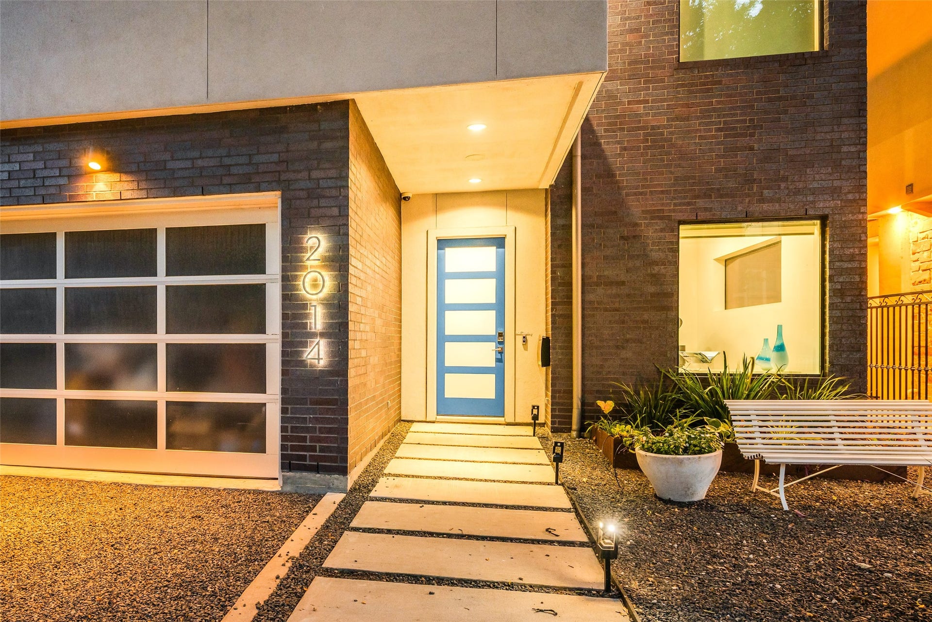 2014 Park Street, Houston, TX 77019 Welcome to 2014 Park Street, a beautiful front entry with custom-painted blue front door, backlit address numbers, black star gravel & paver walkway & modern landscaped planters. Ring door bell.
