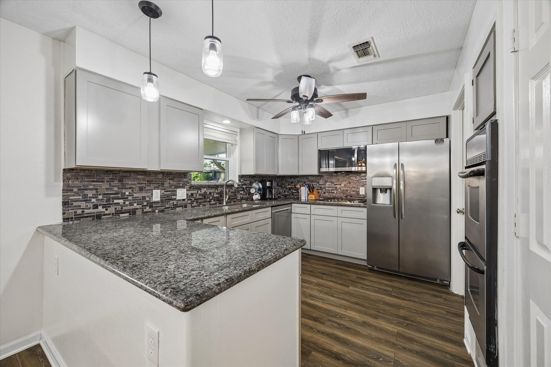 15726 Blackhawk Boulevard, Friendswood, TX 77546 Well designed kitchen with large pantry, and plenty of counter space for cooking.