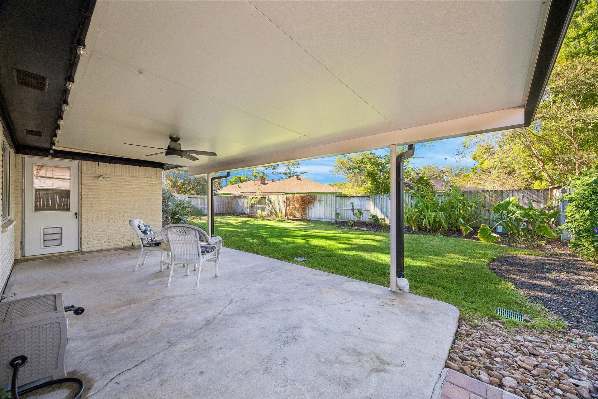 15726 Blackhawk Boulevard, Friendswood, TX 77546 Covered backyard patio.
