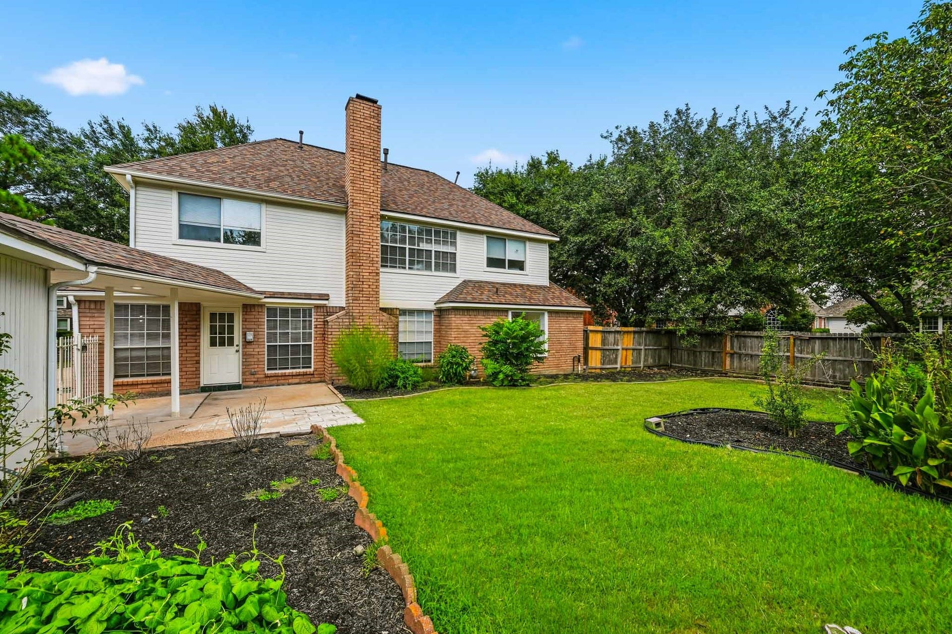 3926 Felicia Drive, Sugar Land, TX 77479 Generous fenced backyard offering plenty of open lawn and space to create your own outdoor retreat.