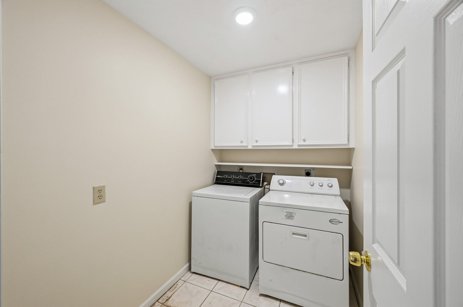 3926 Felicia Drive, Sugar Land, TX 77479 Utility room with built-in upper cabinetry for additional storage.