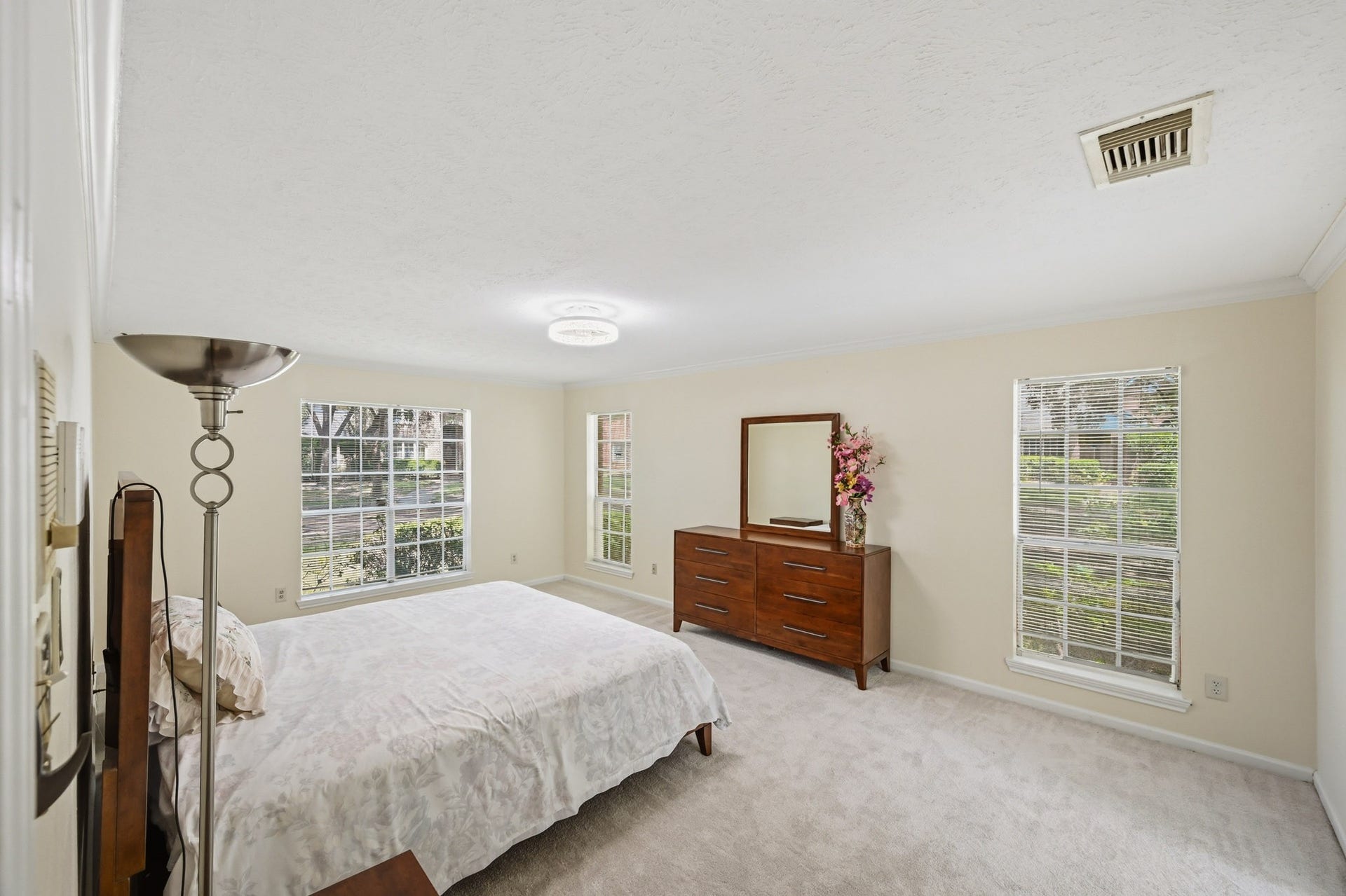 3926 Felicia Drive, Sugar Land, TX 77479 Spacious primary bedroom with multiple windows and plenty of natural light.