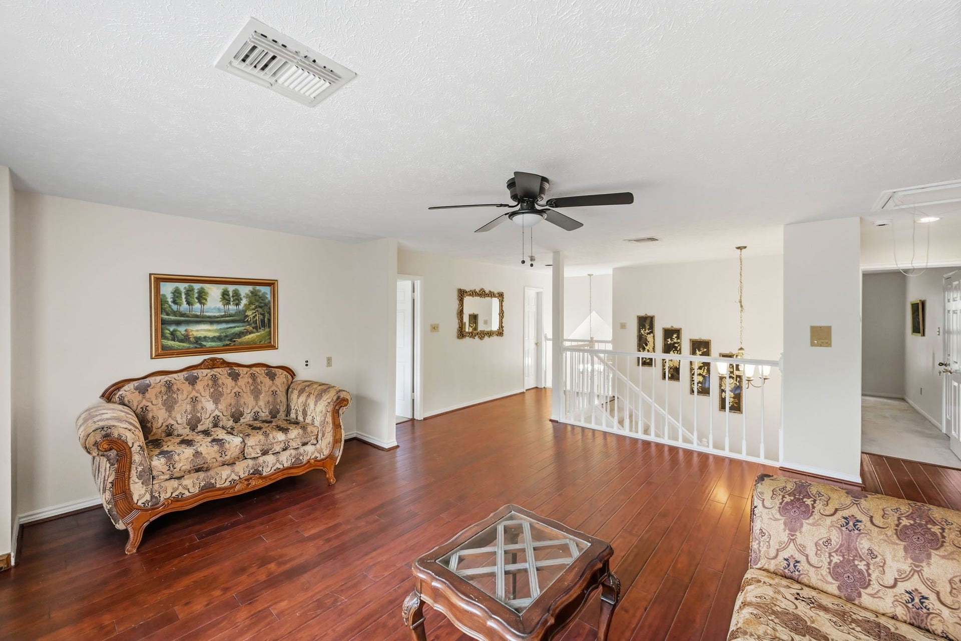 3926 Felicia Drive, Sugar Land, TX 77479 Open upstairs loft with wood flooring and views toward the stairway and surrounding bedrooms.
