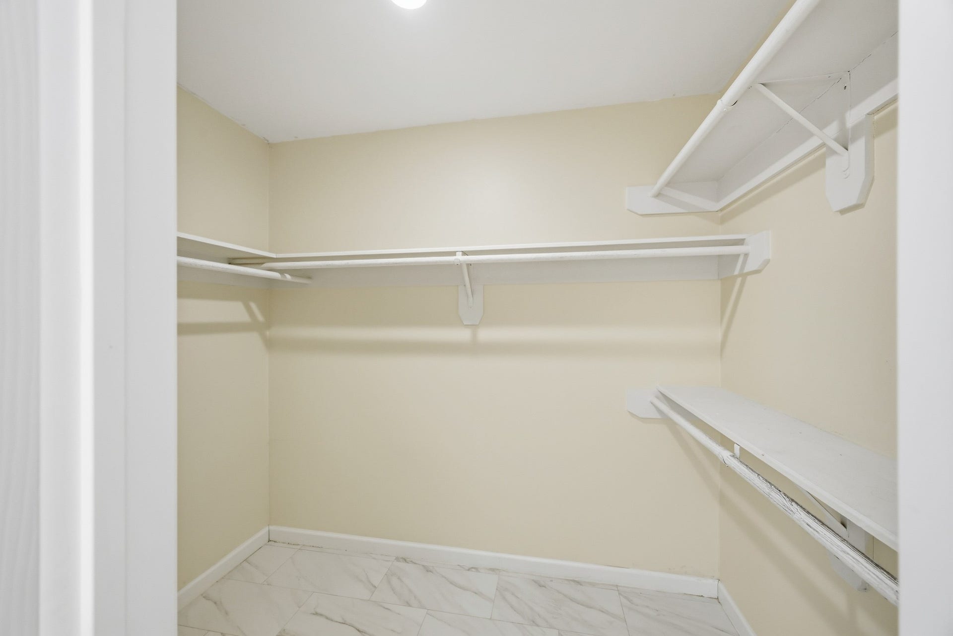3926 Felicia Drive, Sugar Land, TX 77479 Large walk-in primary closet with built-in shelving and hanging space.