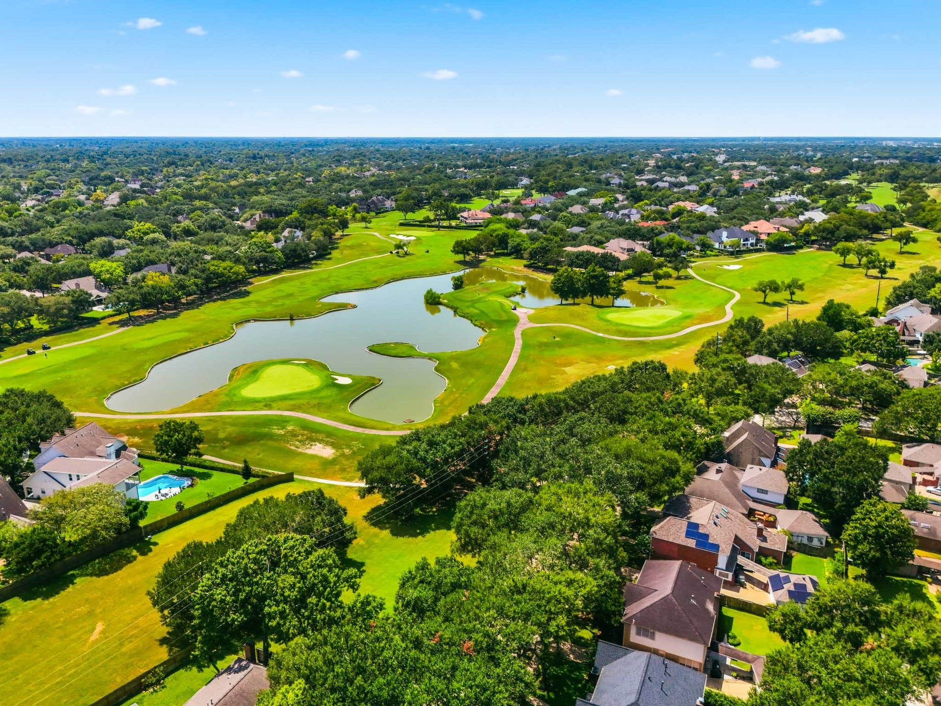 3926 Felicia Drive, Sugar Land, TX 77479 Expansive aerial view of the established, tree-lined neighborhood with the nearby Sweetwater golf course in view.