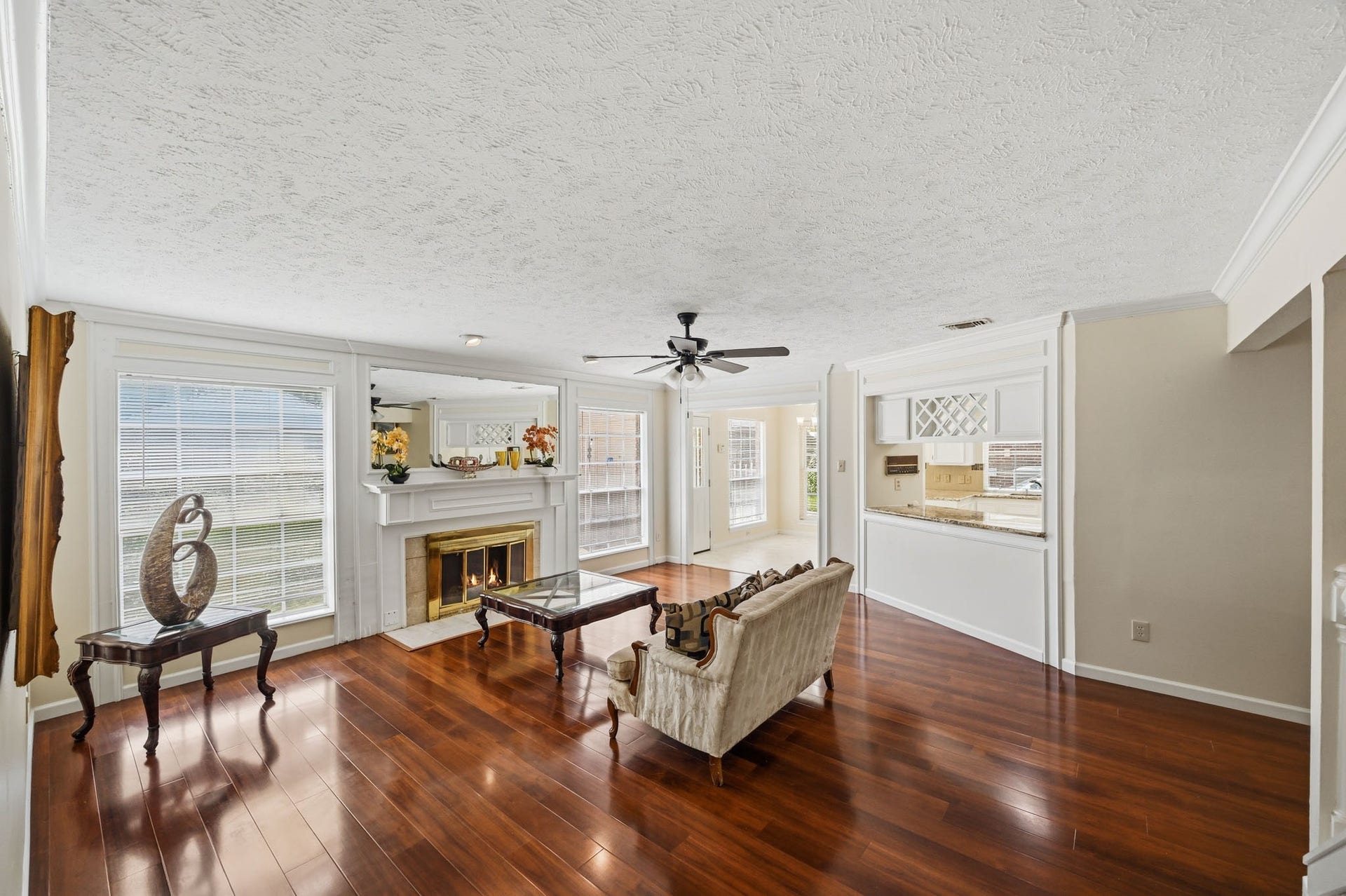 3926 Felicia Drive, Sugar Land, TX 77479 Generously sized living area with fireplace and an open connection to the kitchen and breakfast area.