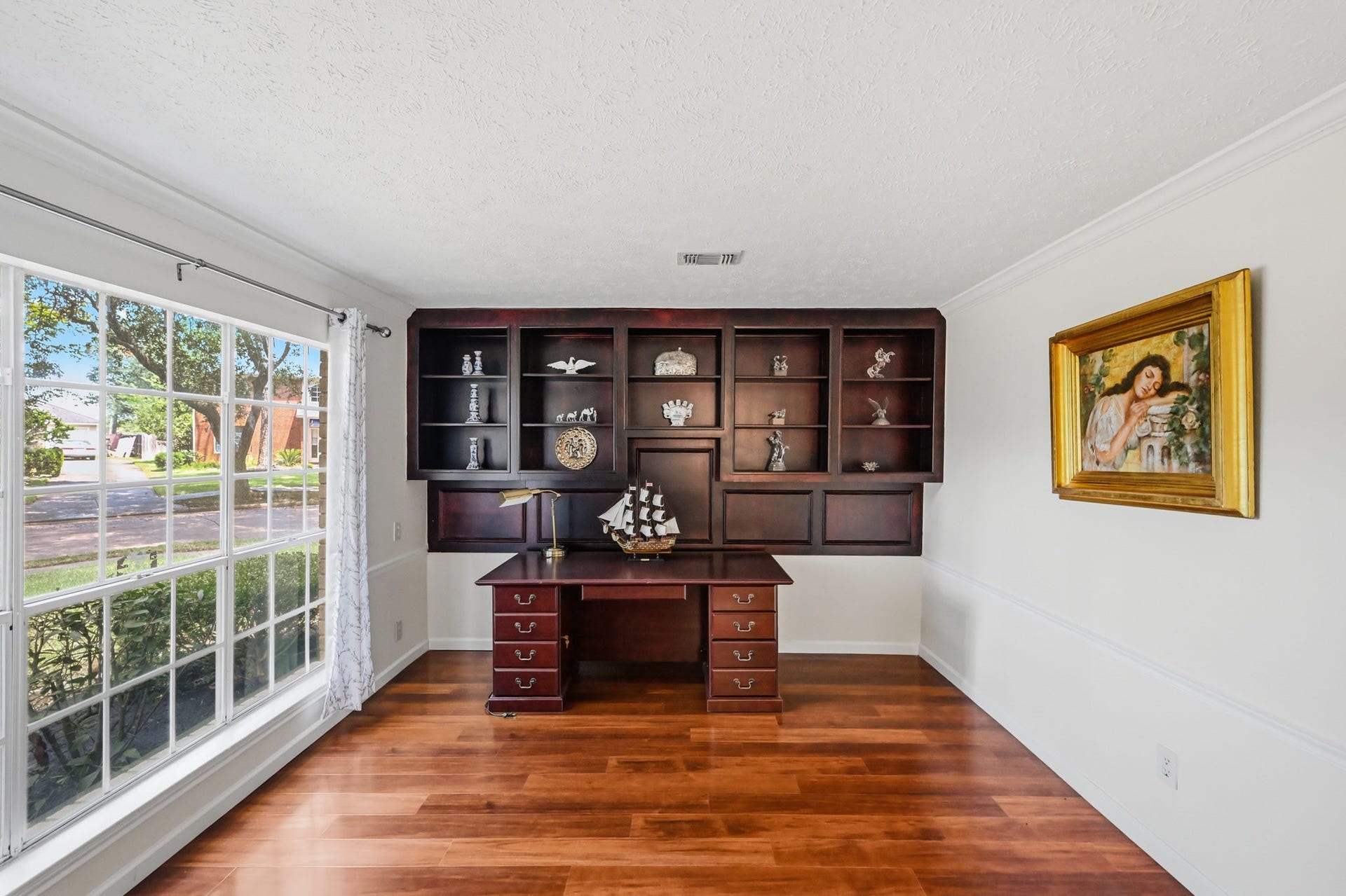 3926 Felicia Drive, Sugar Land, TX 77479 Spacious home office filled with natural light, built in shelves, and conveniently located near the front entry.
