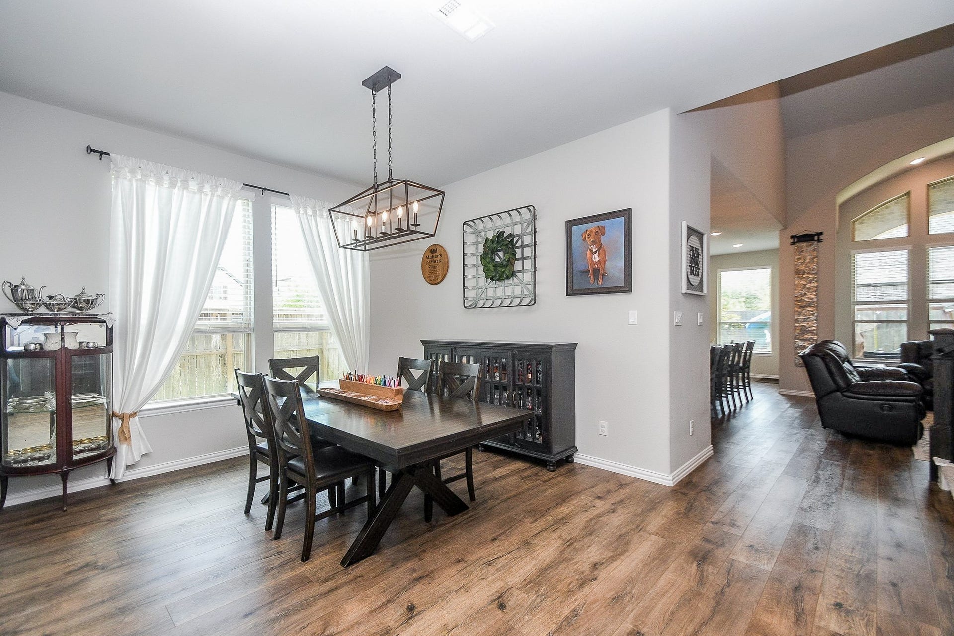 2703 Ripe Amber Cup Court, Richmond, TX 77406 Formal dining room near the front entry with natural light from the large windows overlooking the side yard and easy access to the family room.