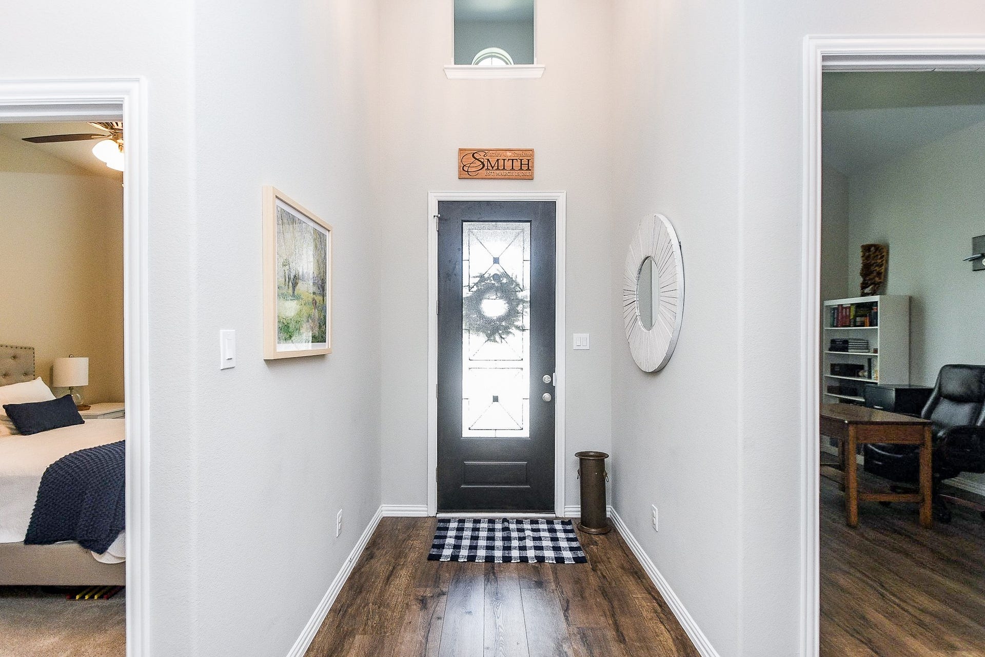 2703 Ripe Amber Cup Court, Richmond, TX 77406 Welcoming front entry with leaded glass door, tall ceiling and luxury vinyl plank flooring that continues through the main first-floor living areas.