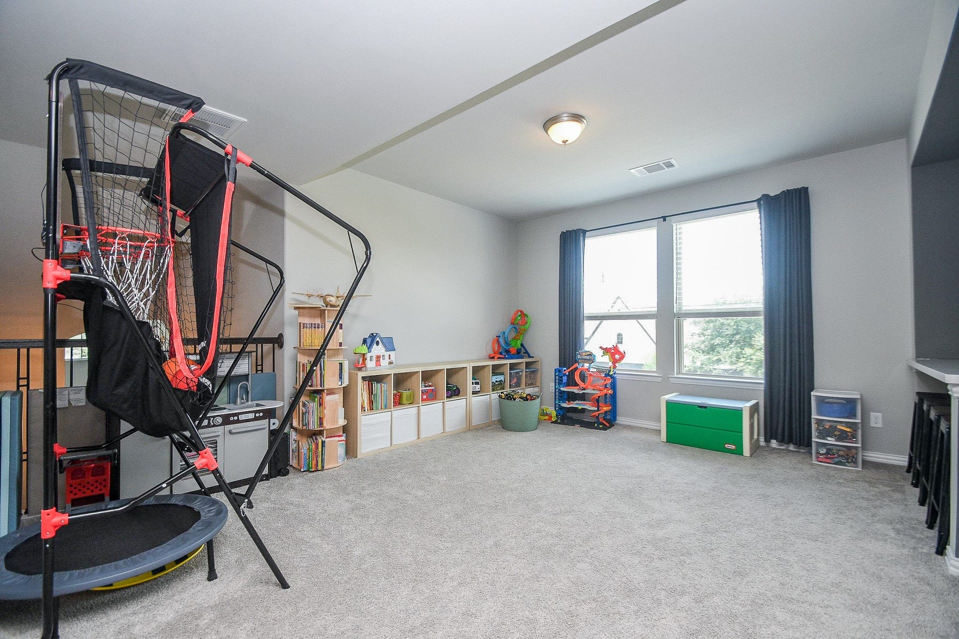 2703 Ripe Amber Cup Court, Richmond, TX 77406 Game room offers a spacious upstairs gathering area with windows overlooking the front of the home.