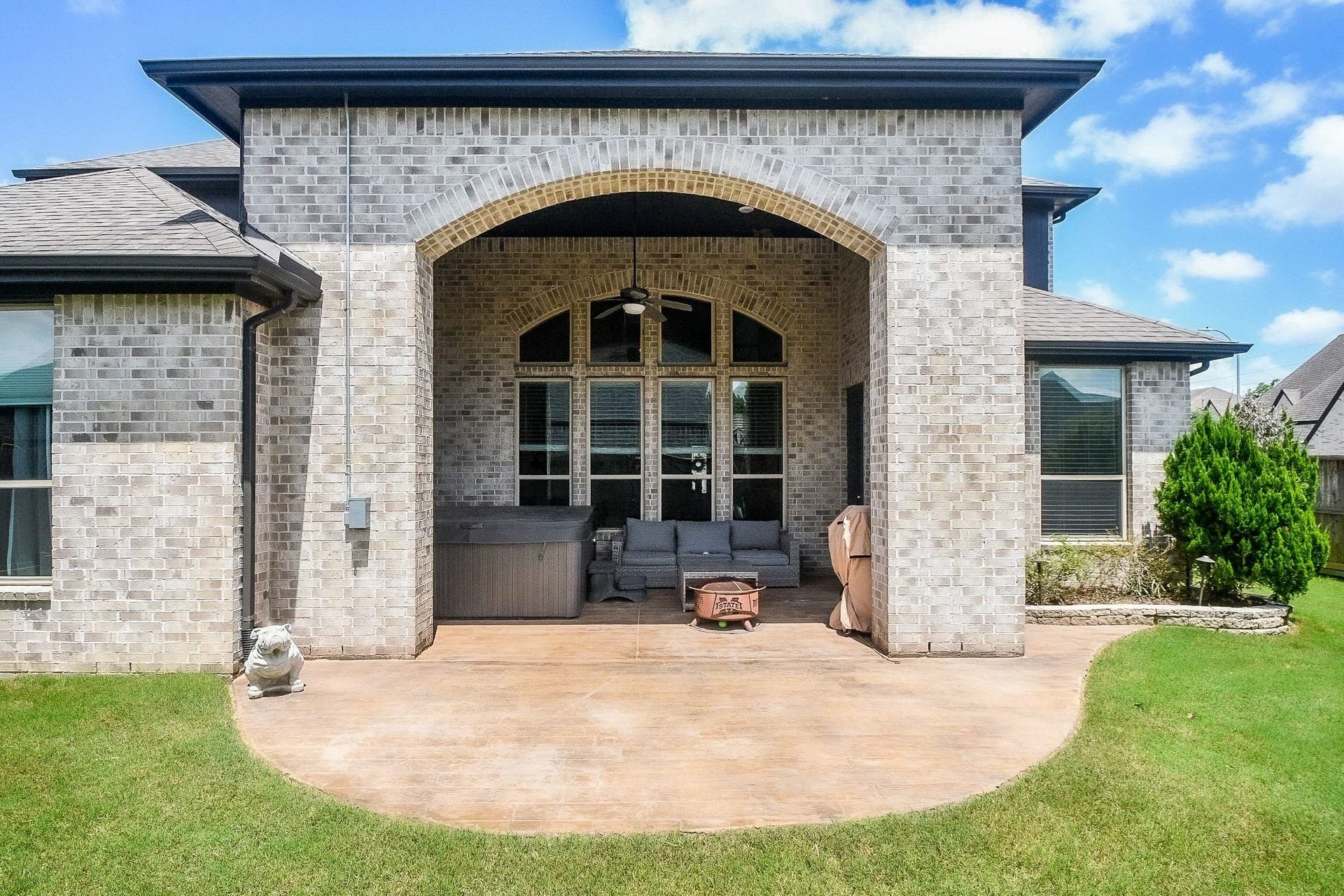 2703 Ripe Amber Cup Court, Richmond, TX 77406 Covered back patio with room for outdoor seating, grilling area and hot tub that may remain with the home. Enjoy the custom stampled pattern coating on the patio.