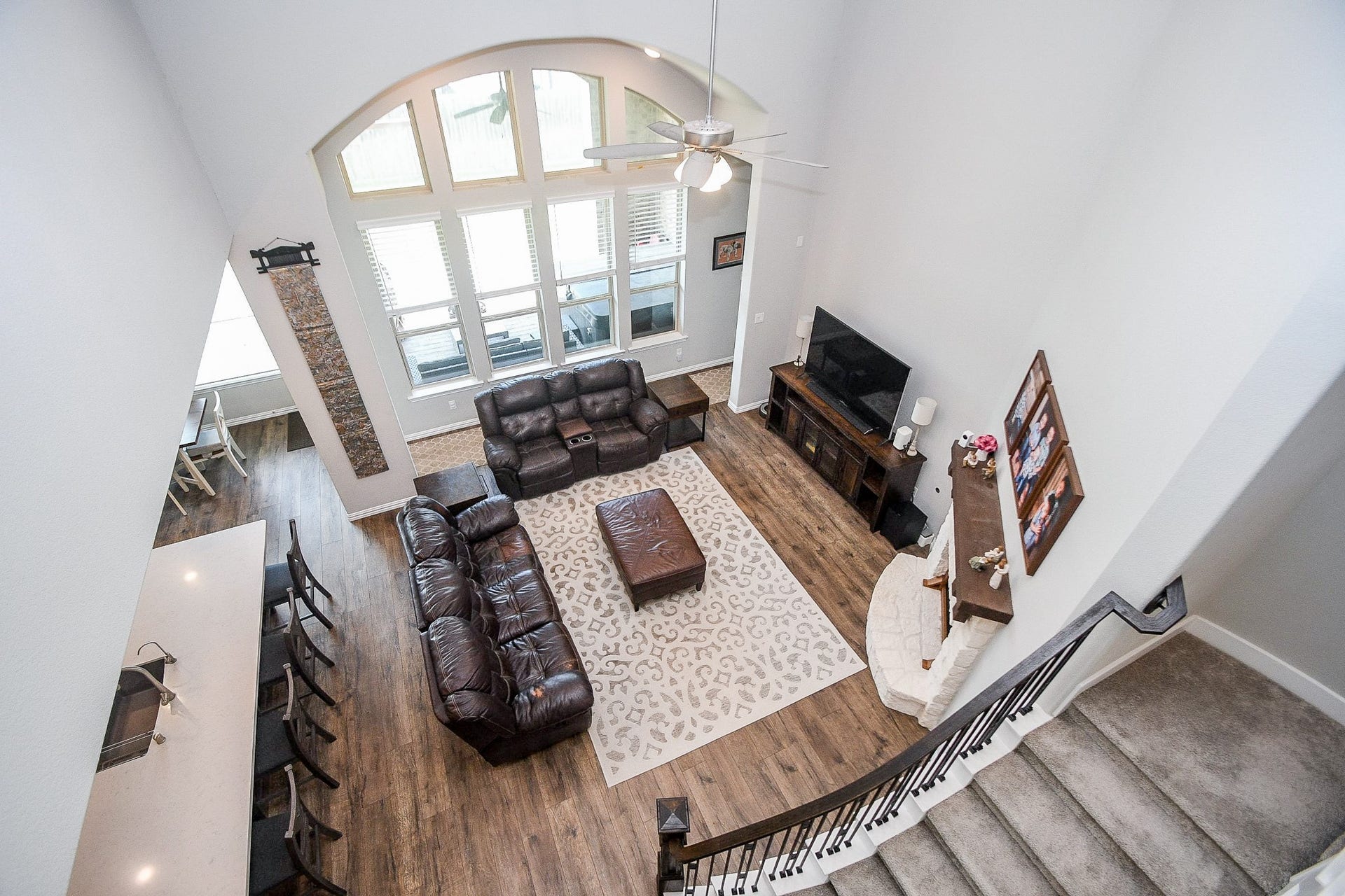 2703 Ripe Amber Cup Court, Richmond, TX 77406 Overhead view from the second floor shows the scale of the family room, kitchen island seating and open floorplan.