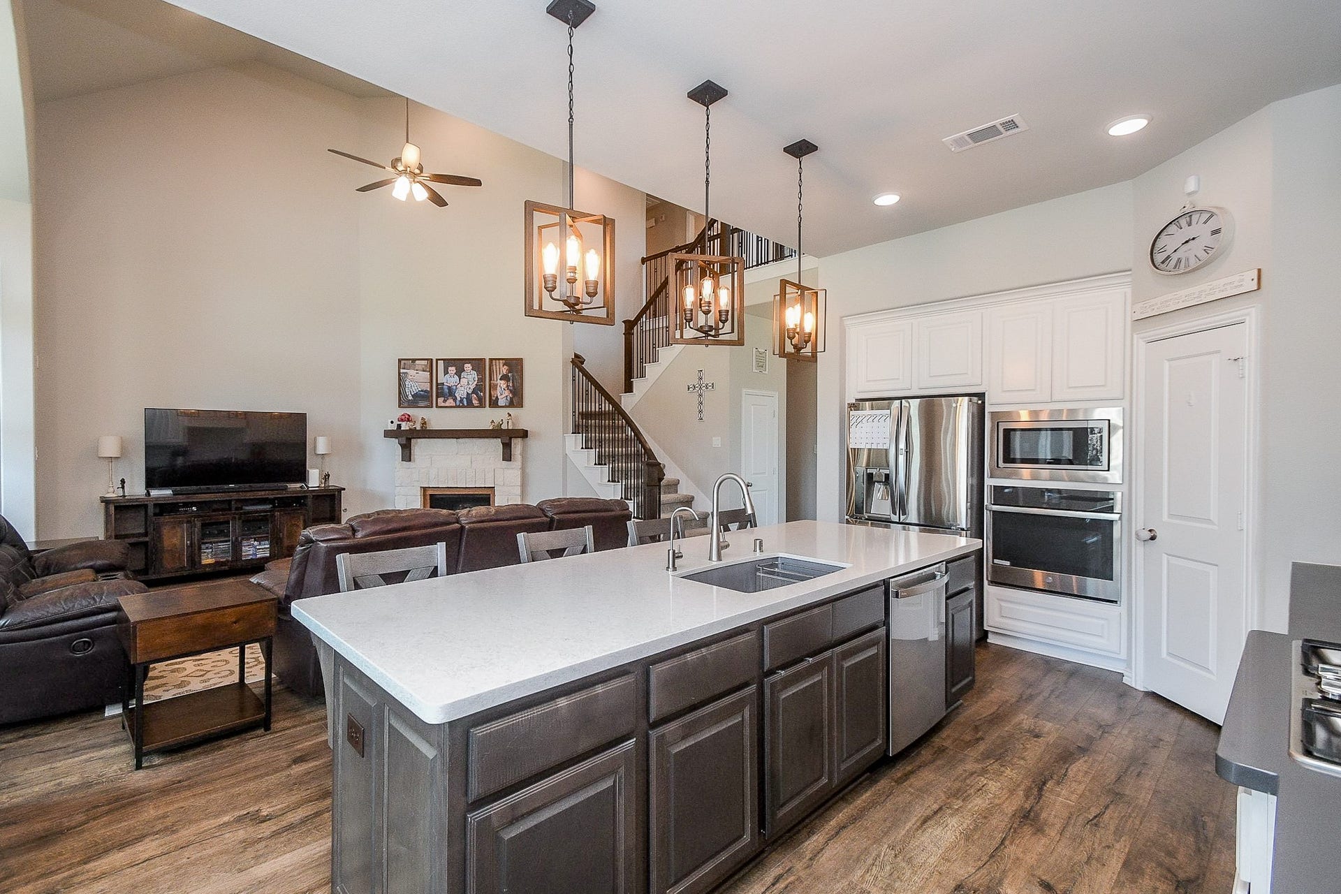 2703 Ripe Amber Cup Court, Richmond, TX 77406 Large kitchen island with farmhouse sink, stainless steel appliances, walk-in pantry and secondary walk-in pantry nearby.