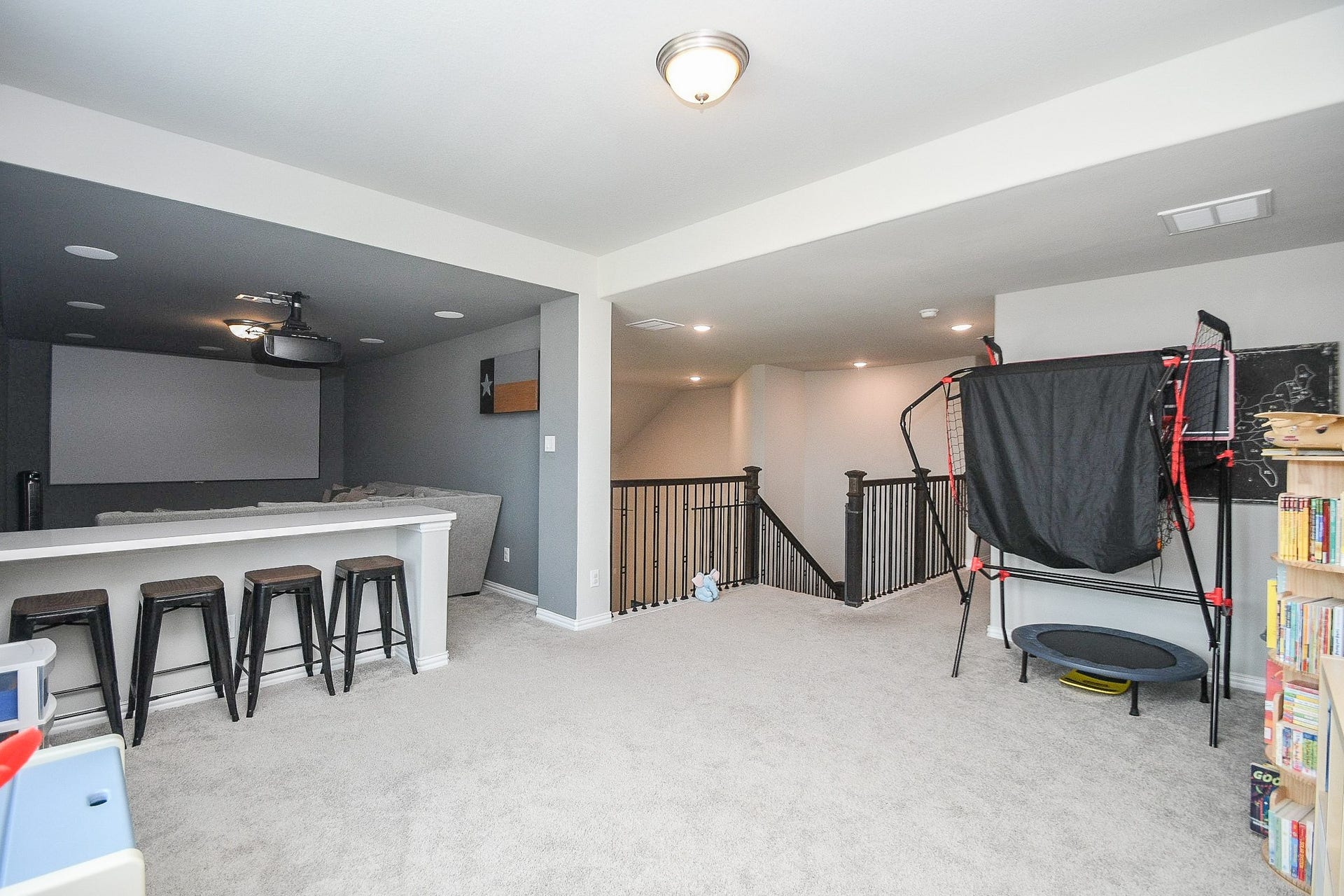 2703 Ripe Amber Cup Court, Richmond, TX 77406 Upstairs game room connects directly to the media room and overlooks the stairway landing.